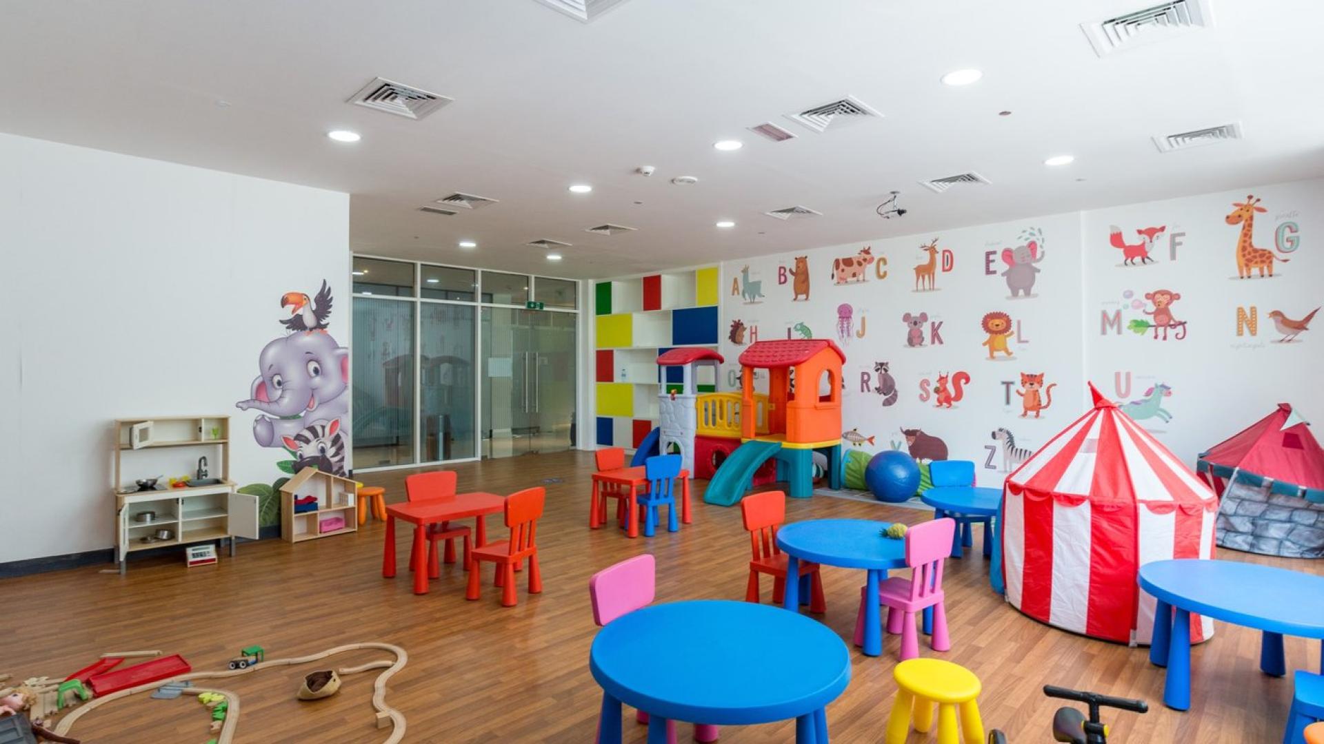 Children's playroom in Vezul Residence apartment, Business Bay, with colorful furniture and decor