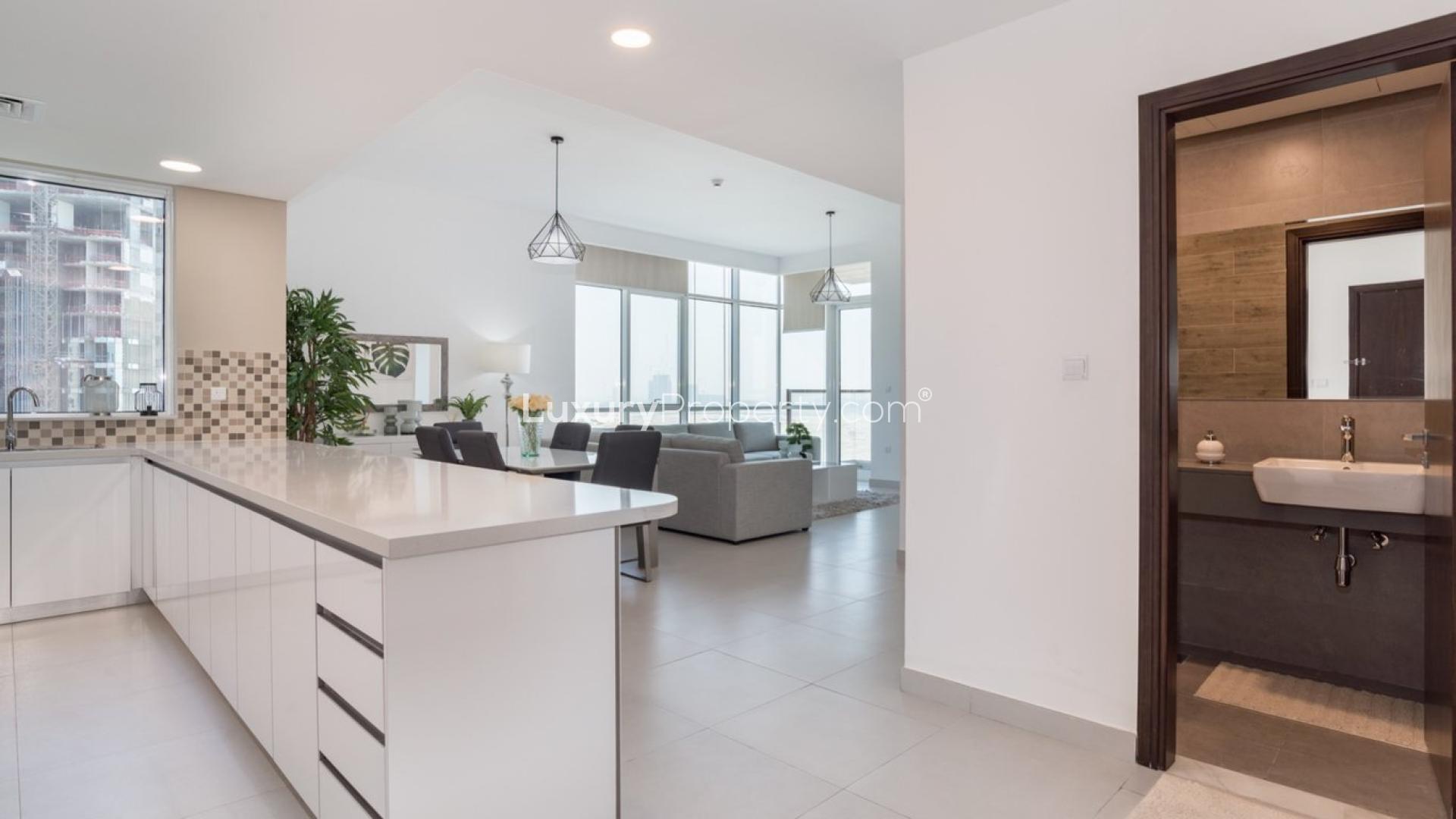 Modern kitchen and living area in Vezul Residence apartment, Business Bay, for sale