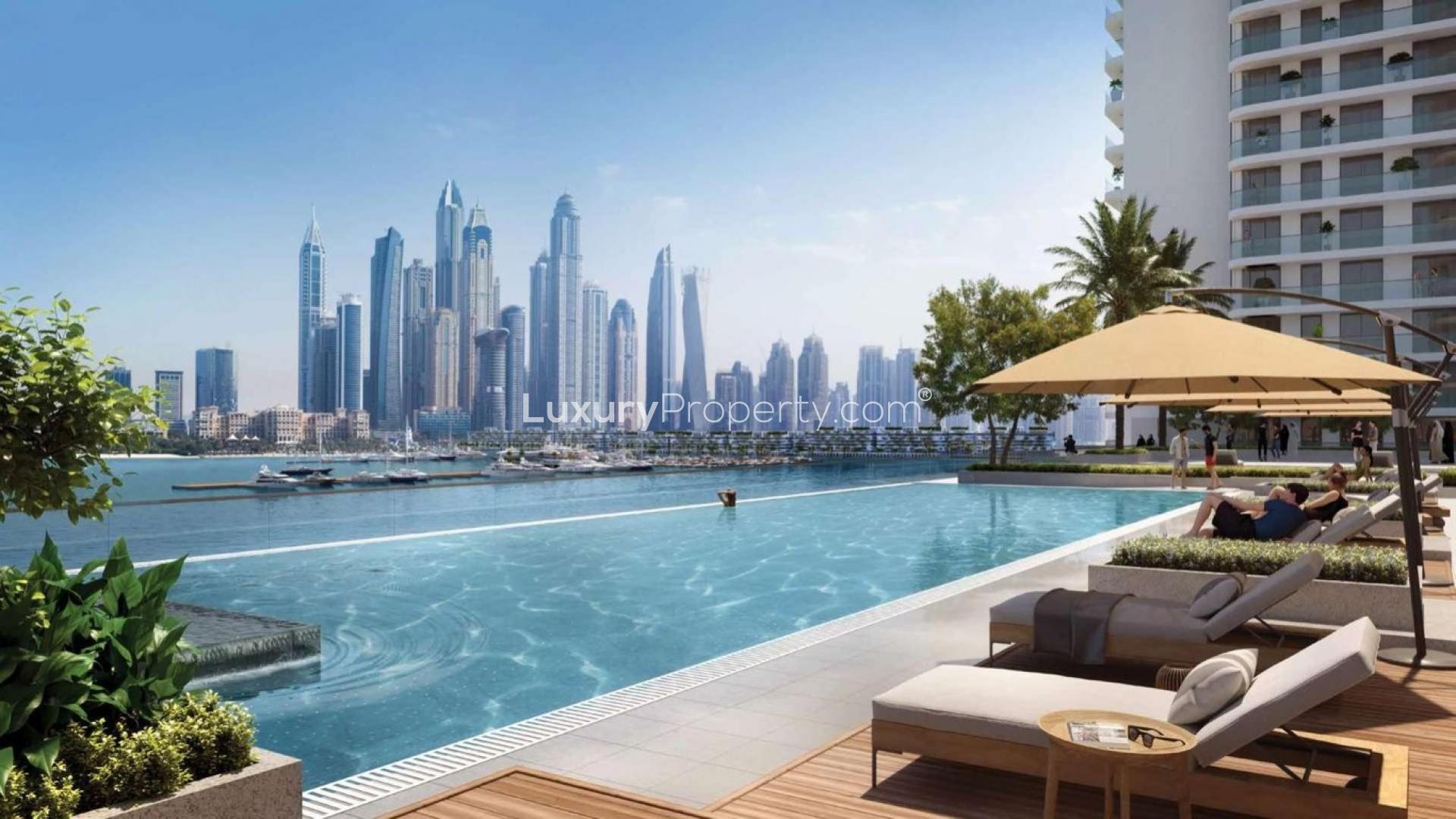 Infinity pool with city skyline view at Emaar Beachfront, Dubai Harbour apartment for sale