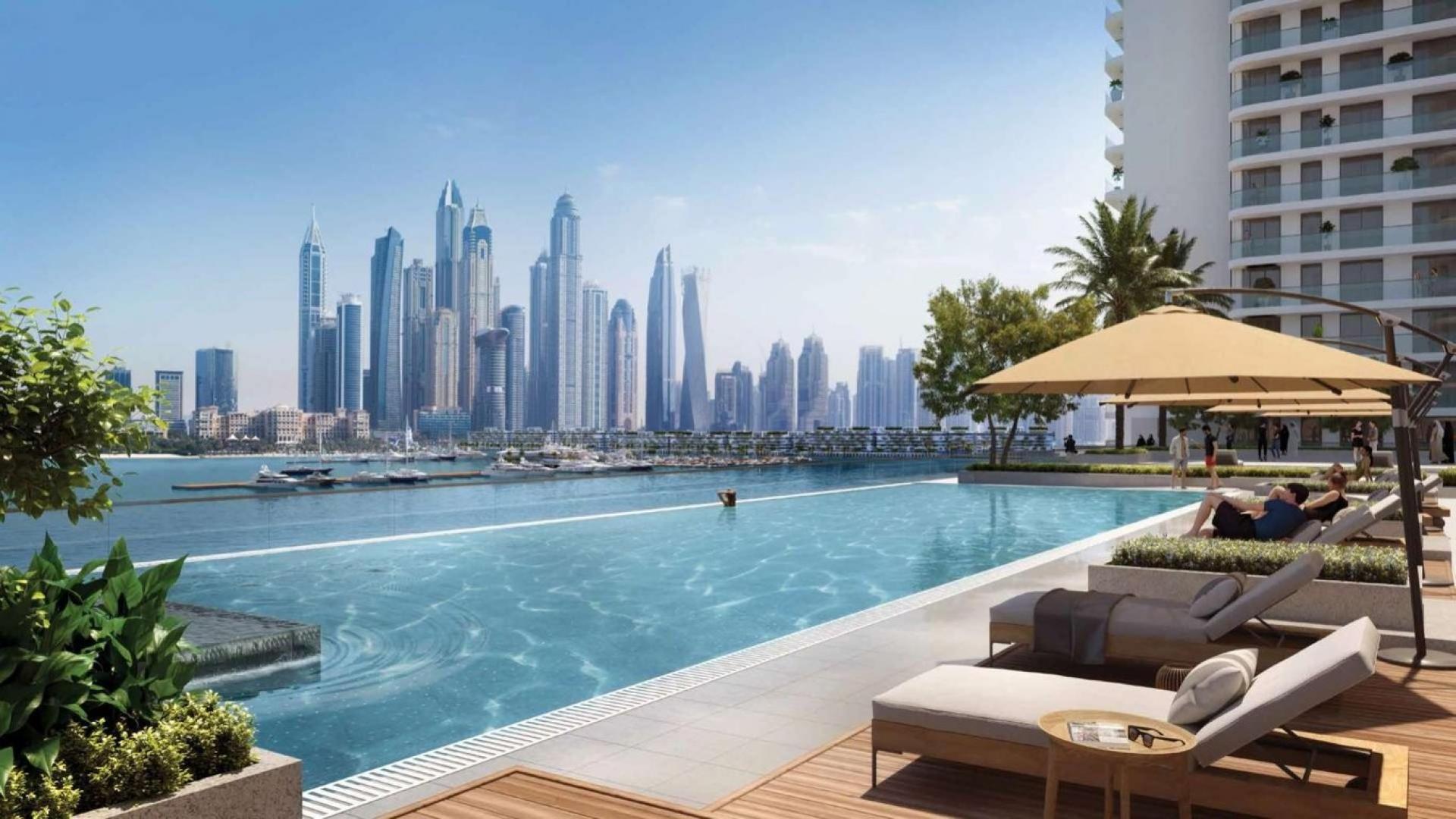 Top floor apartment view of Dubai Harbour beach and skyline at Emaar Beachfront