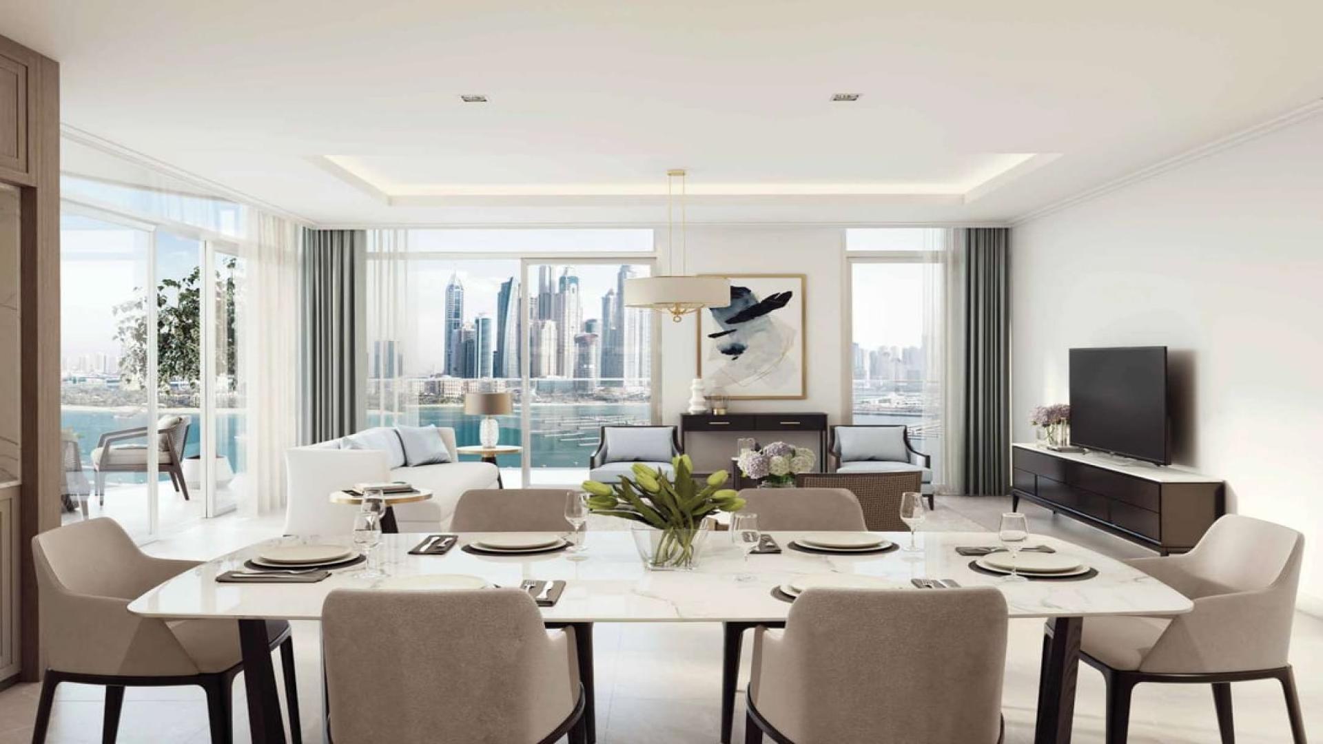 High-floor Emaar Beachfront apartment view, overlooking Palm Jumeirah and Dubai Harbour skyline