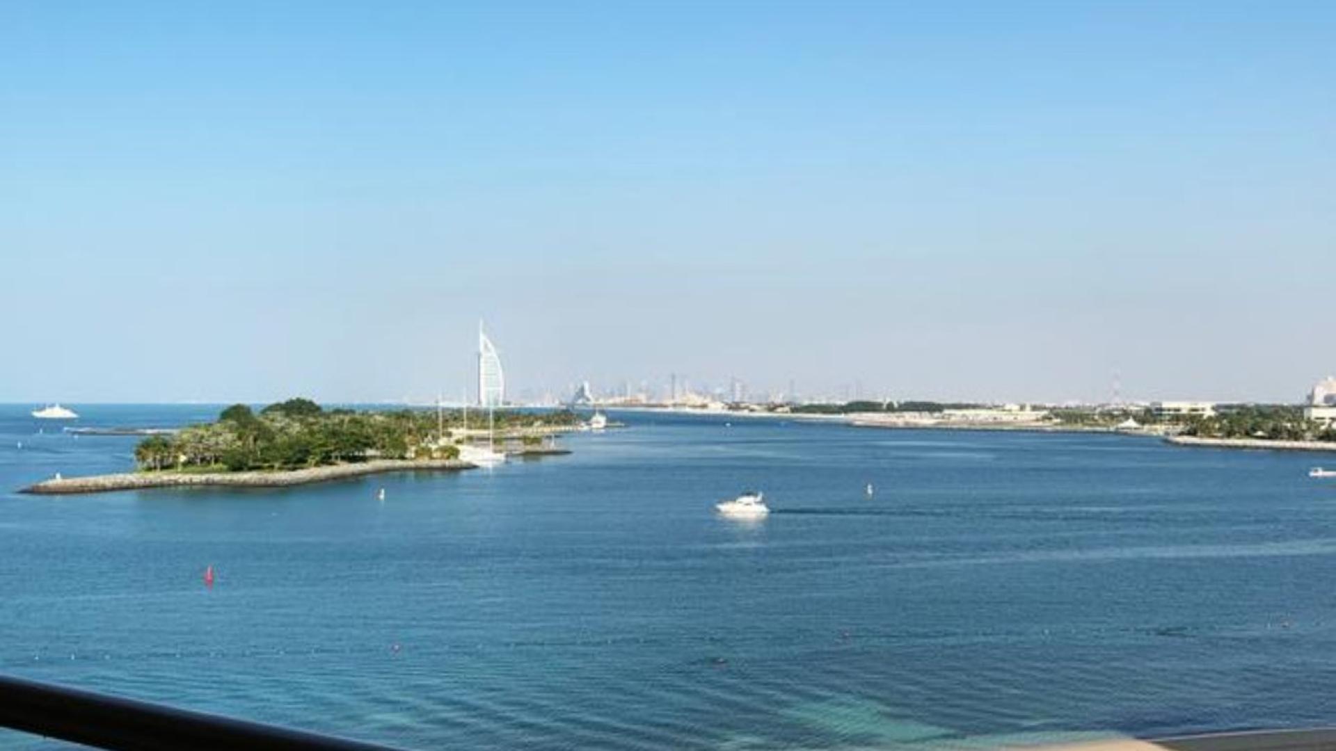 "Stunning sea view from Shoreline Apartments, Palm Jumeirah, 3-bed Type A for sale.","Stunning sea view from 3-bed apartment in Shoreline Apartments, Palm Jumeirah for sale.","Stunning sea view from Shoreline Apartments, Palm Jumeirah, with beachfront access and skyline backdrop.",Dining area and kitchen in 3-bedroom apartment, Shoreline Apartments, Palm Jumeirah, for sale.