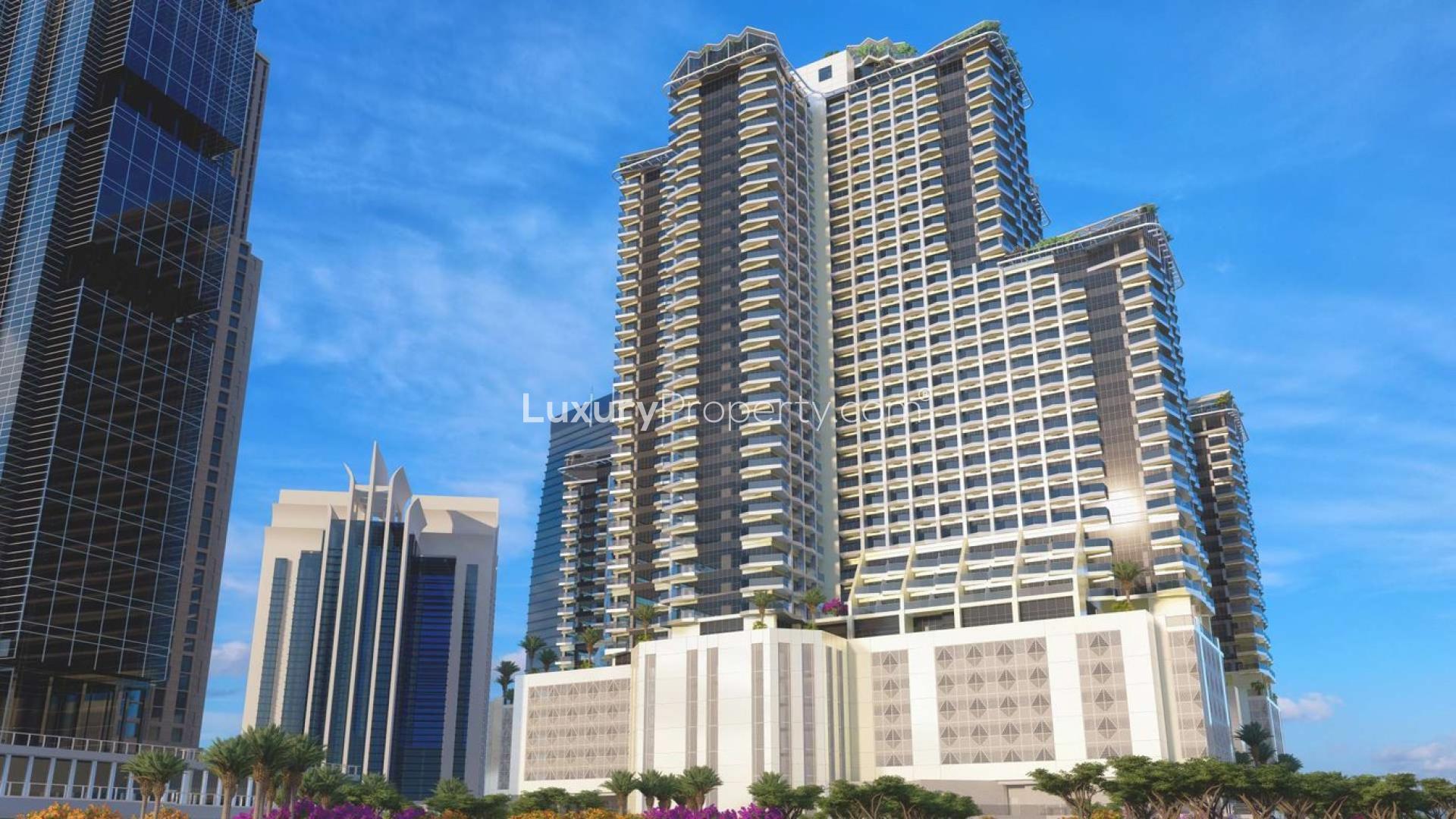 Jumeirah Lake Towers Se7en City apartment exterior with lake view and surrounding skyscrapers