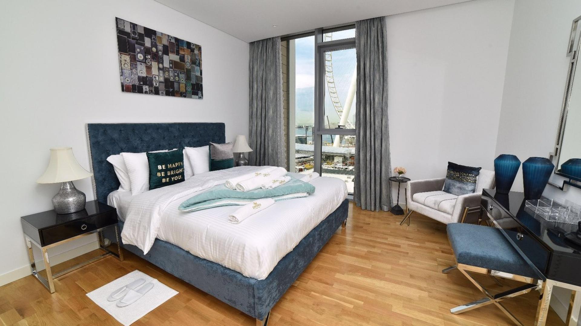 Renovated Bluewaters Island apartment living room with sea views and modern decor