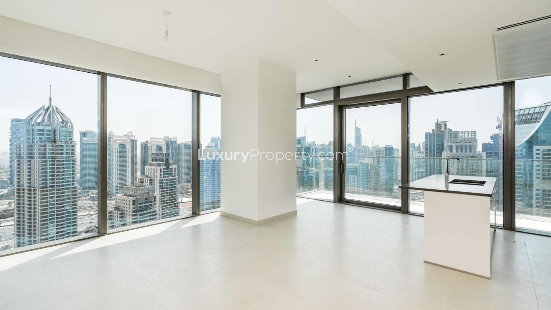 Aerial view of Dubai Marina with skyscrapers and yachts, near Marina Gate apartments for sale