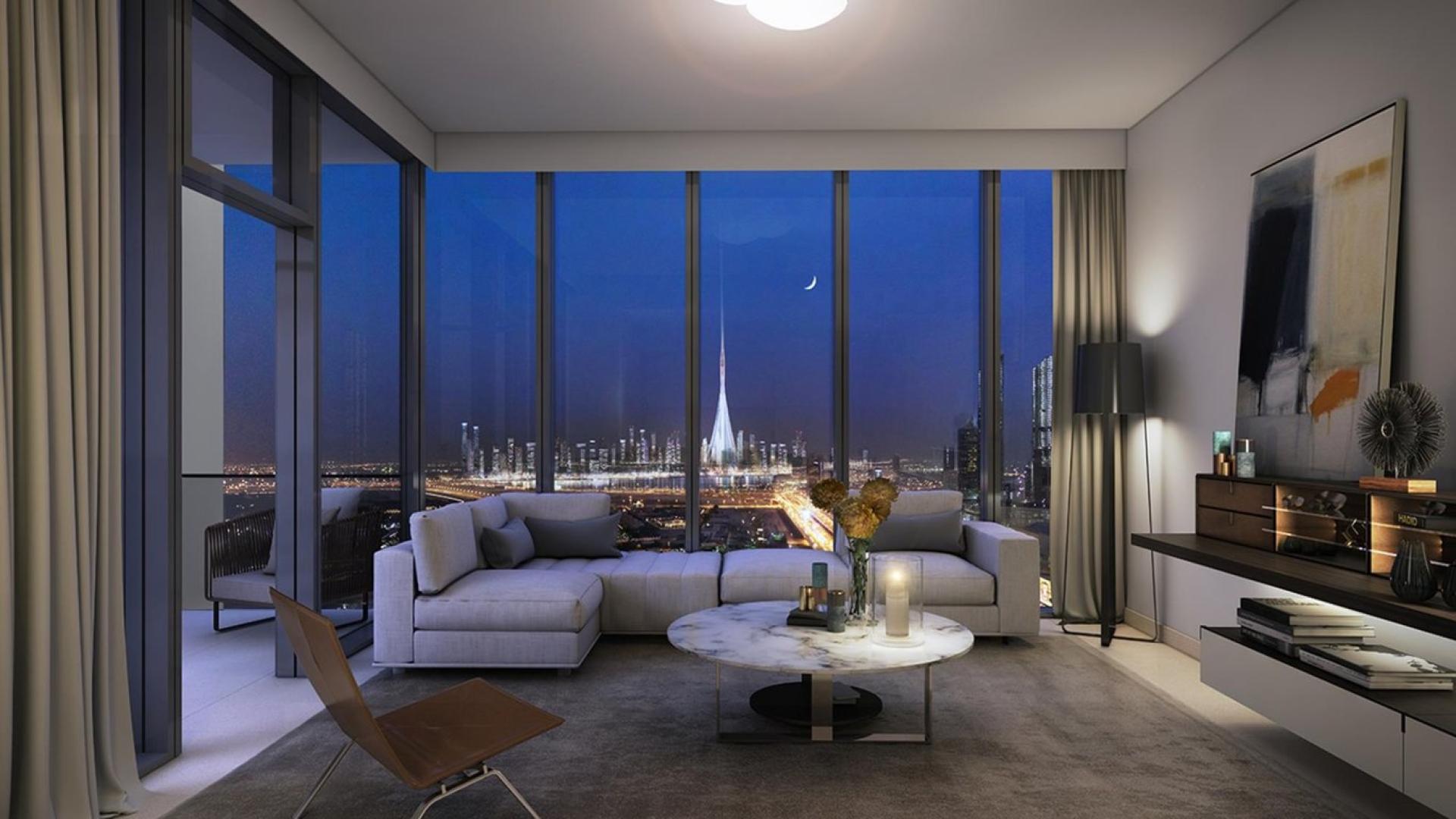 Modern Downtown Dubai apartment living room with city skyline views at night