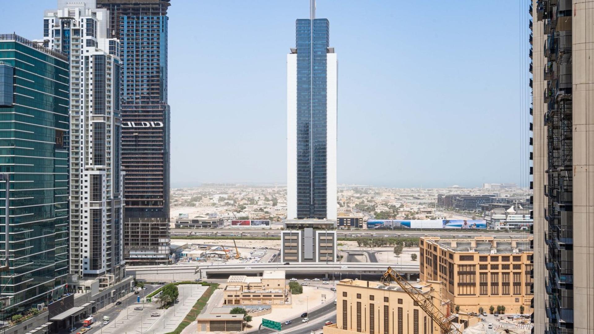 Bright, spacious living area in three-bed apartment, BLVD Crescent, Downtown Dubai