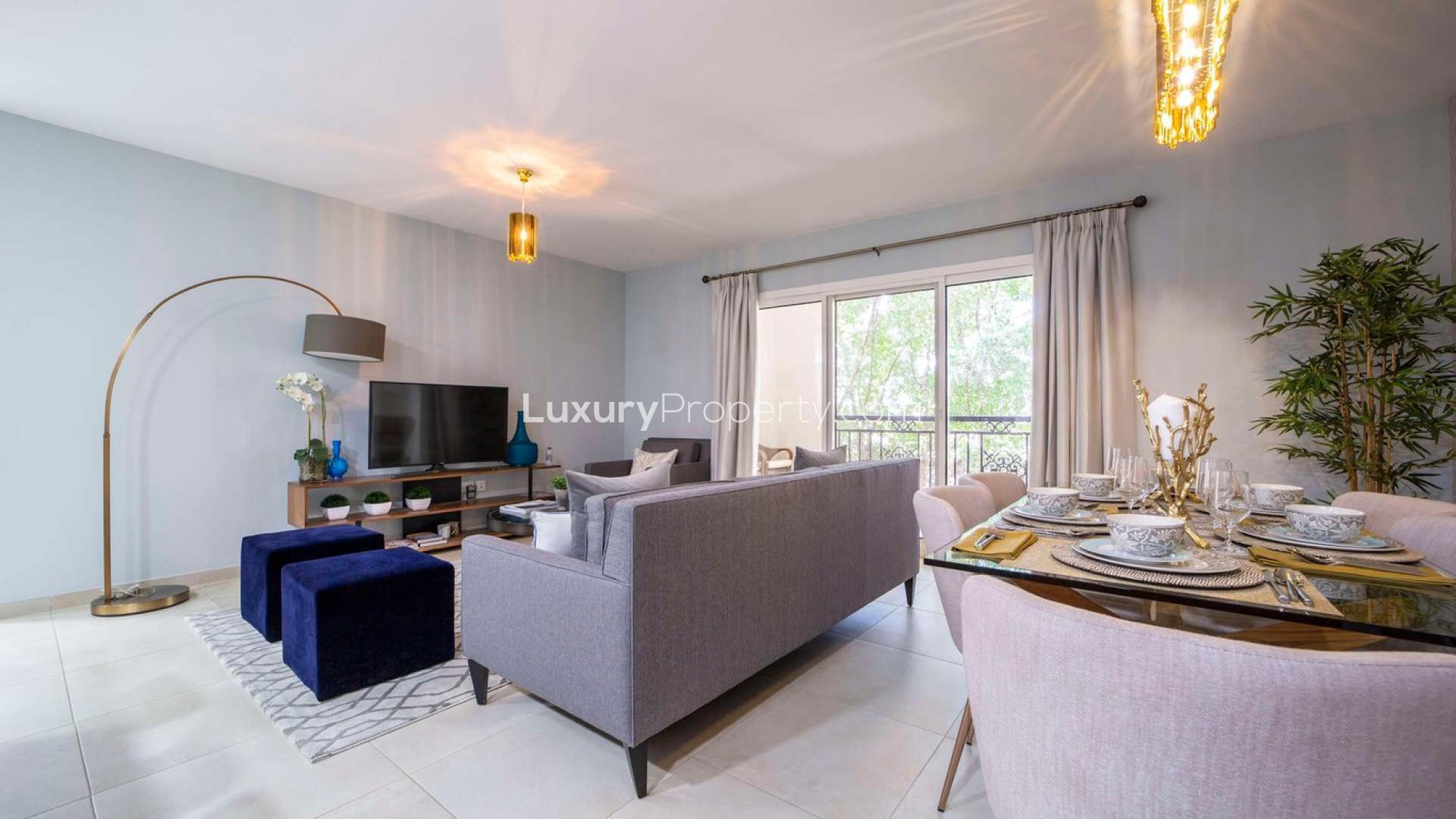 Modern open-plan living and kitchen area in Al Andalus Tower F apartment, Jumeirah Golf Estates