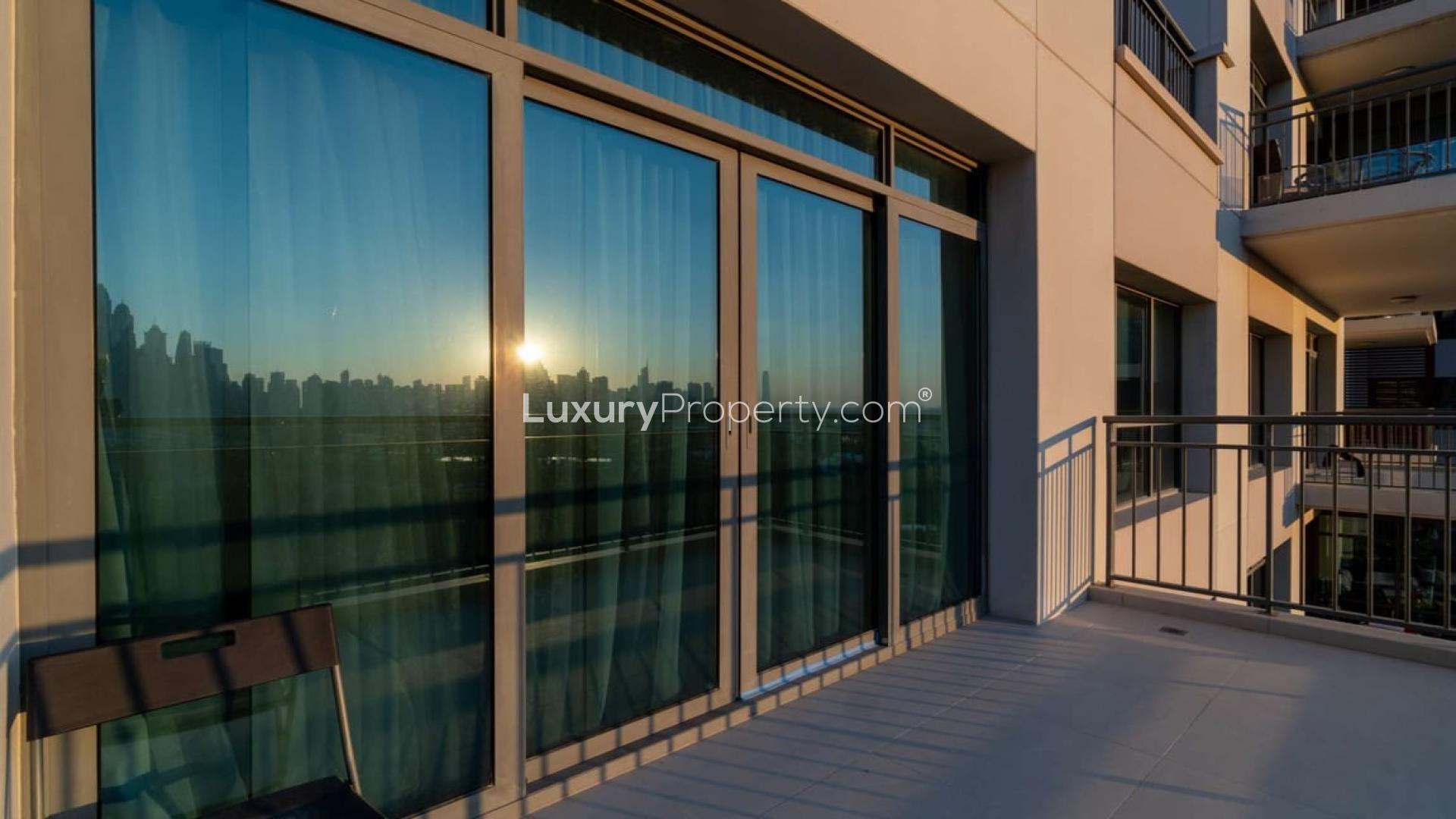 "Stunning sunset view from 3-bedroom triplex apartment balcony in Panorama, The Views.","Sunlit balcony view from triplex apartment in Panorama, The Views, Dubai skyline visible.",Sunny balcony view of 3-bedroom triplex apartment in Panorama, The Views