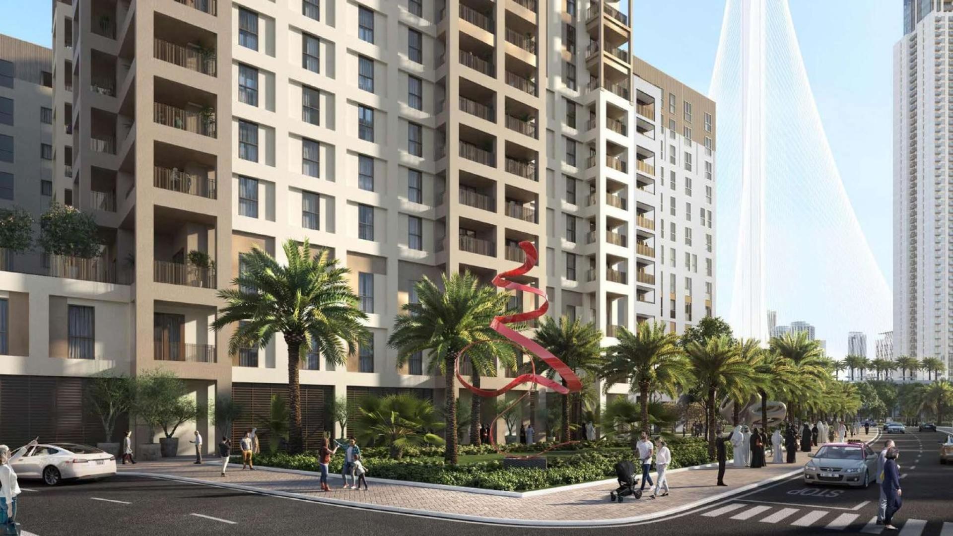 Modern living room in high-floor apartment, Dubai Creek Harbour, featuring elegant decor and stunning views