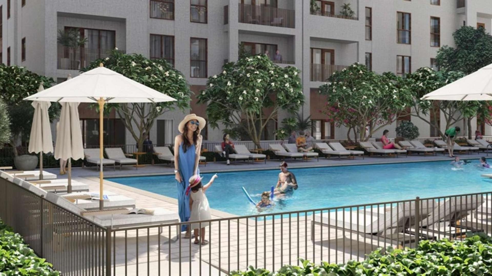 High-floor 3-bedroom apartment exterior, Dubai Creek Harbour, Creek Beach, surrounded by lush landscaping
