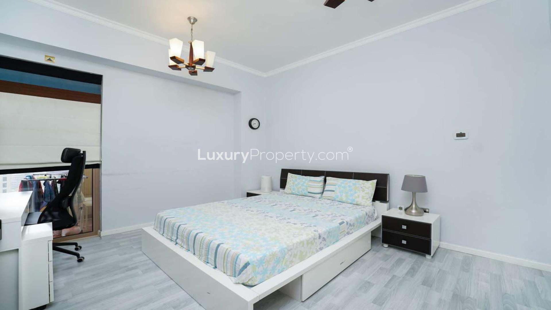 "Spacious bedroom with sea view in upgraded Jumeirah Beach Residence apartment, Rimal community.",Modern bedroom in upgraded Jumeirah Beach Residence apartment, Rimal, featuring stylish decor and workspace