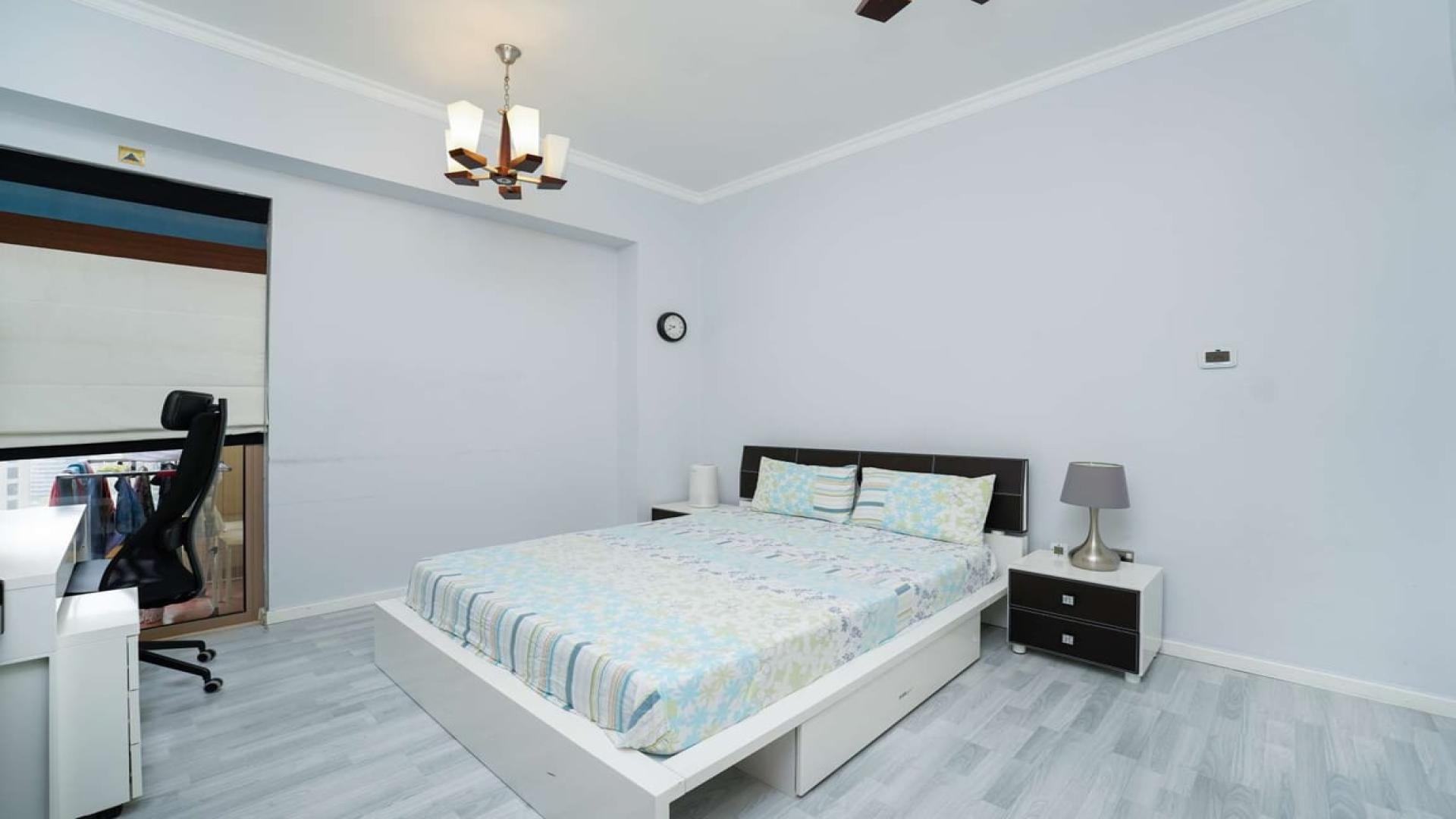 "Spacious bedroom with sea view in upgraded Jumeirah Beach Residence apartment, Rimal community.",Modern bedroom in upgraded Jumeirah Beach Residence apartment, Rimal, featuring stylish decor and workspace