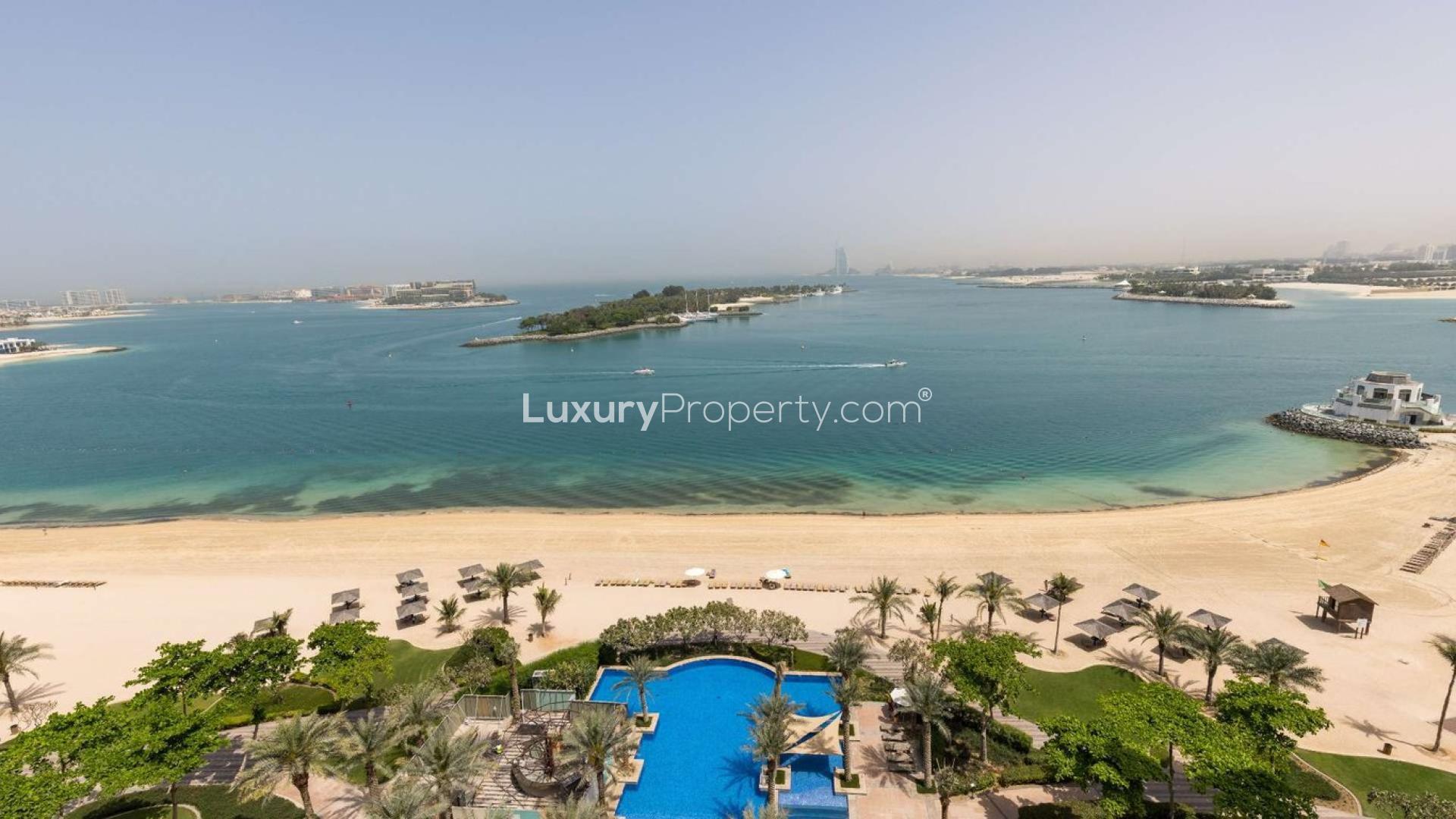 Sea view from Palm Jumeirah apartment for sale, featuring beach access and pool