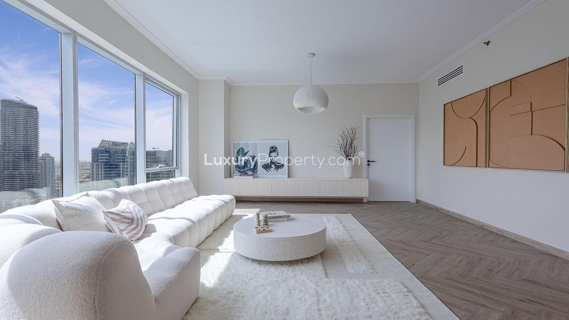 Stunning upgraded Dubai Marina apartment living room with modern decor and marina views