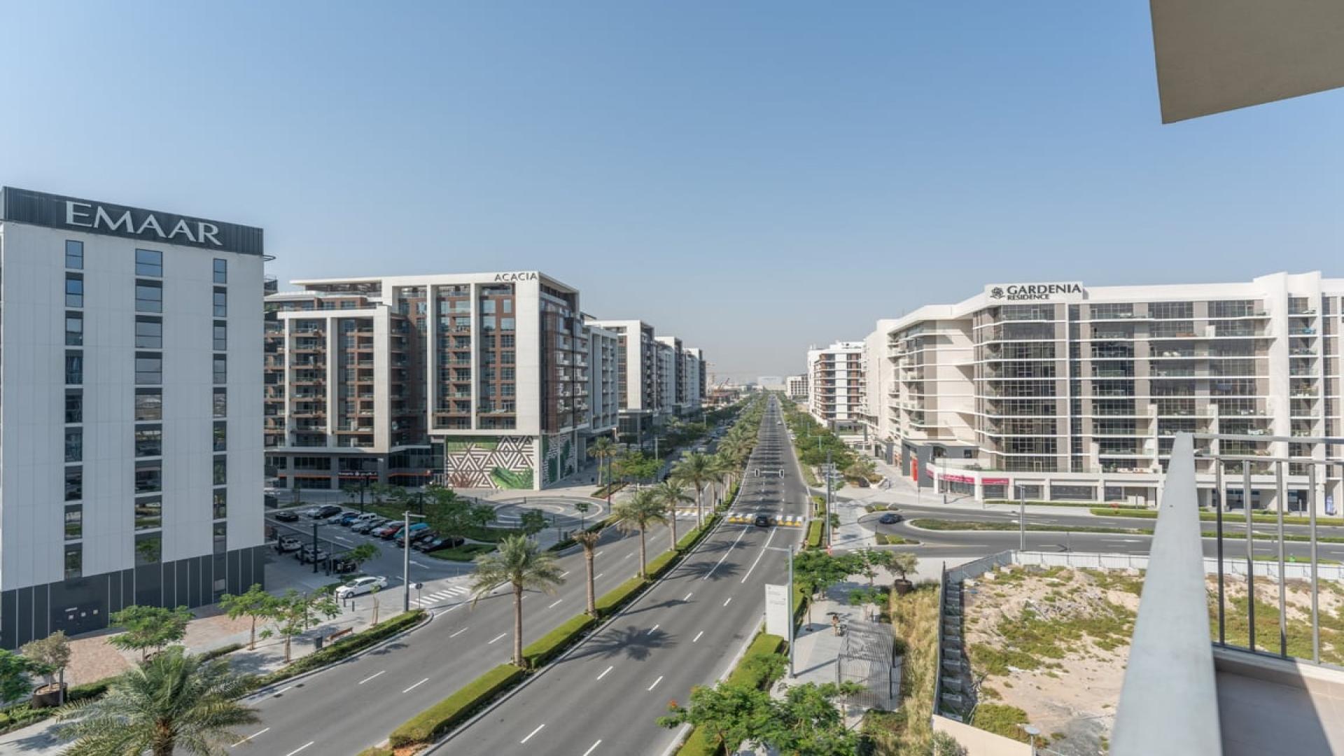 Spacious living room with large windows in Dubai Hills Estate apartment for sale