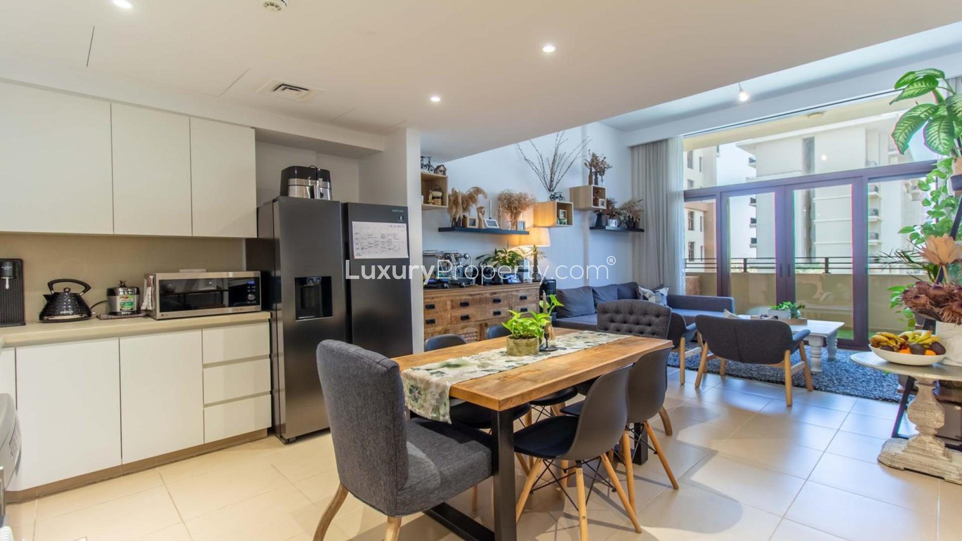 Luxurious open-plan kitchen and living area in Warda, Town Square Dubai apartment