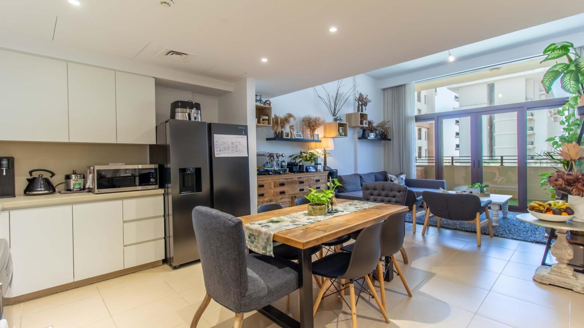 Luxurious open-plan kitchen and living area in Warda, Town Square Dubai apartment