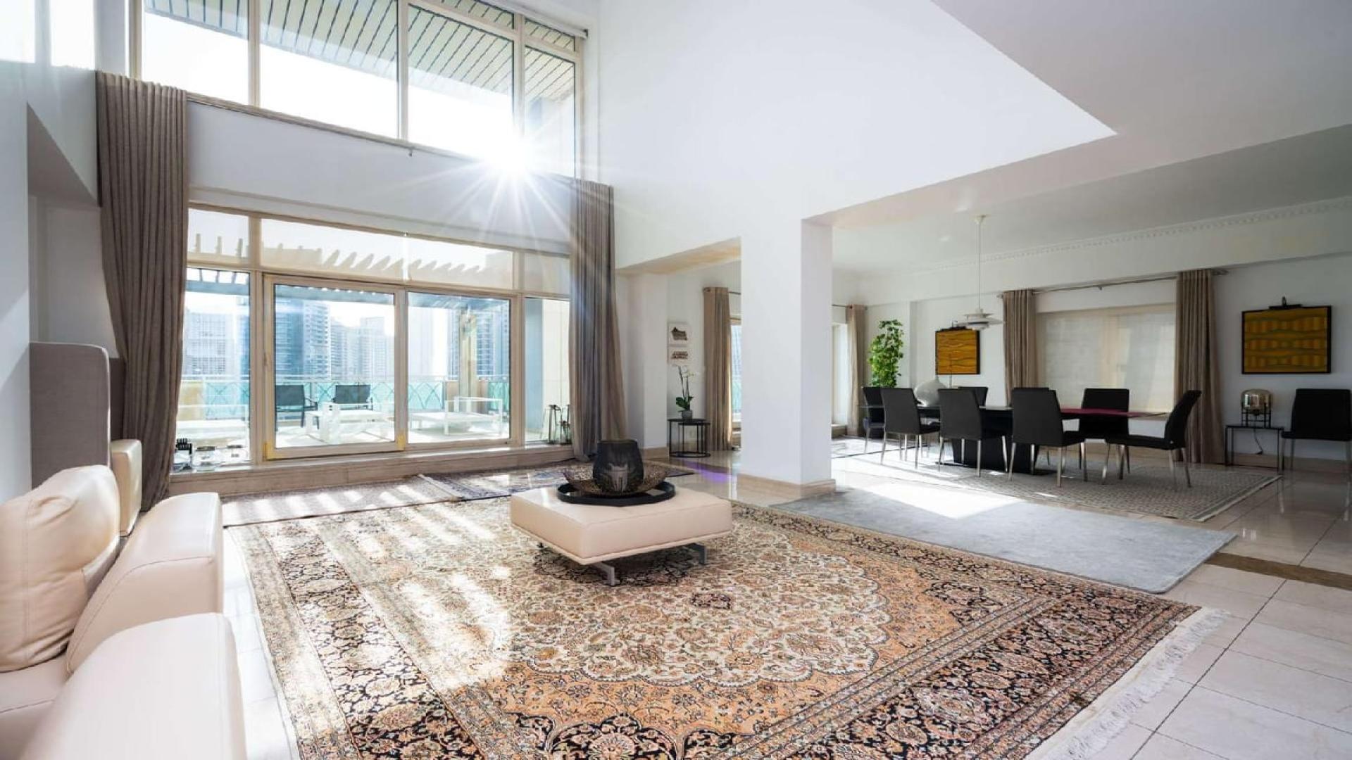 "Stunning marina view from luxurious 3-bedroom penthouse in Fairooz Tower, Dubai Marina.",Luxurious living room in Fairooz Tower penthouse with full Marina views, Dubai Marina