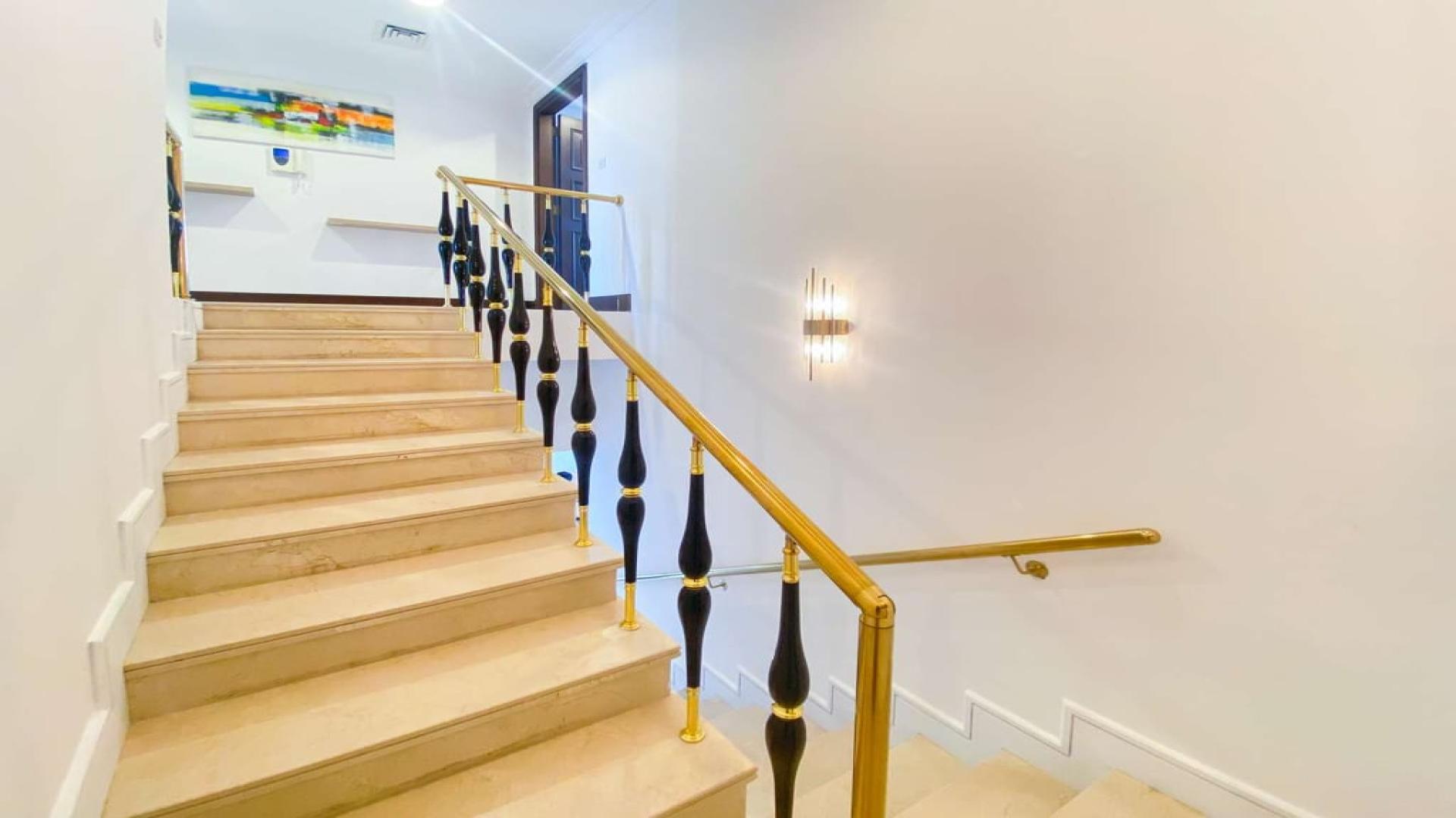 Luxurious living room in 3-bedroom penthouse, Palm Jumeirah, with modern decor and sea views