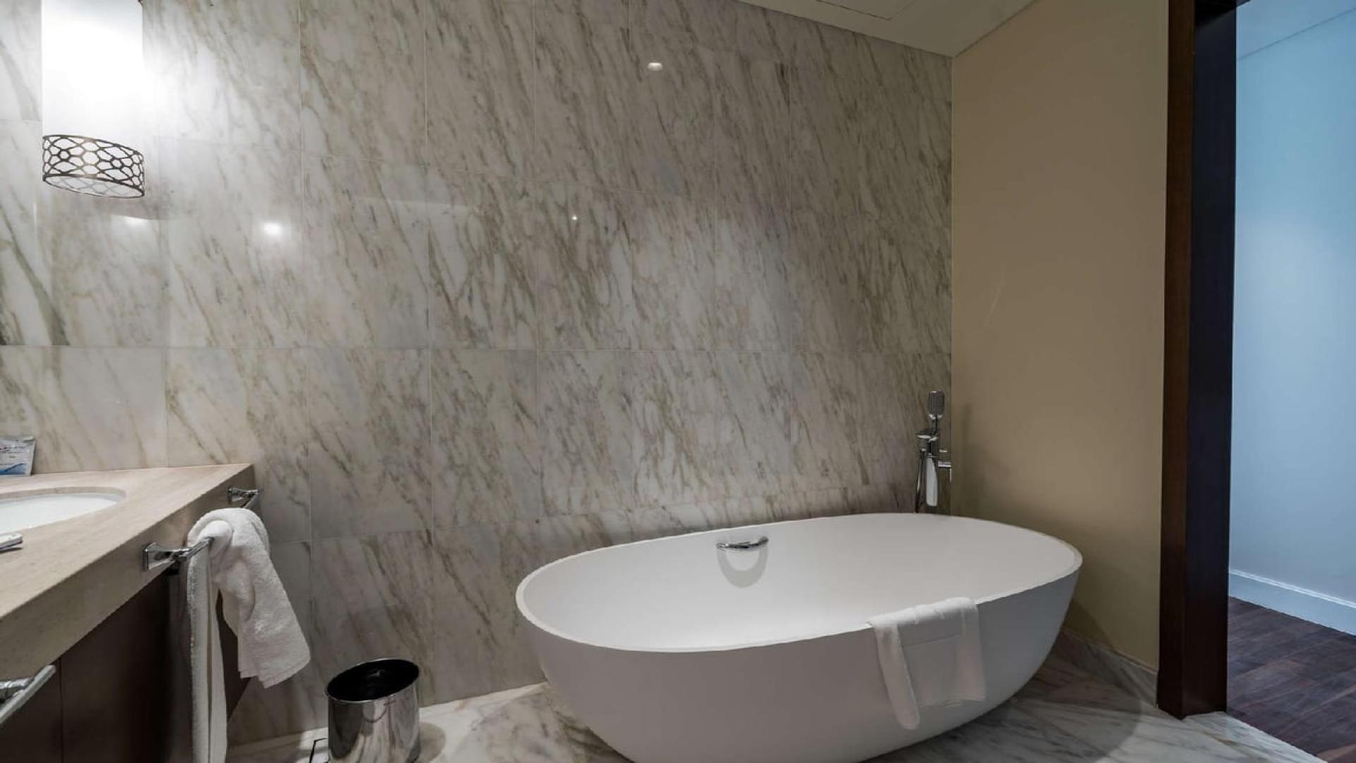 Luxurious marble bathroom with freestanding tub in Downtown Dubai penthouse for sale