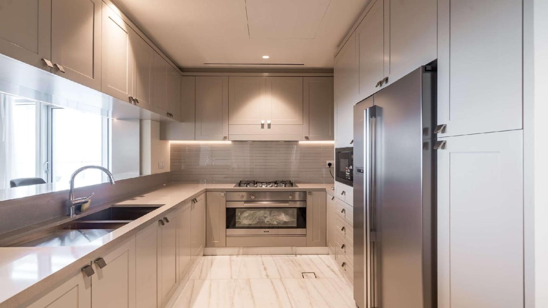 Luxurious living and dining area in Downtown Dubai penthouse with city views