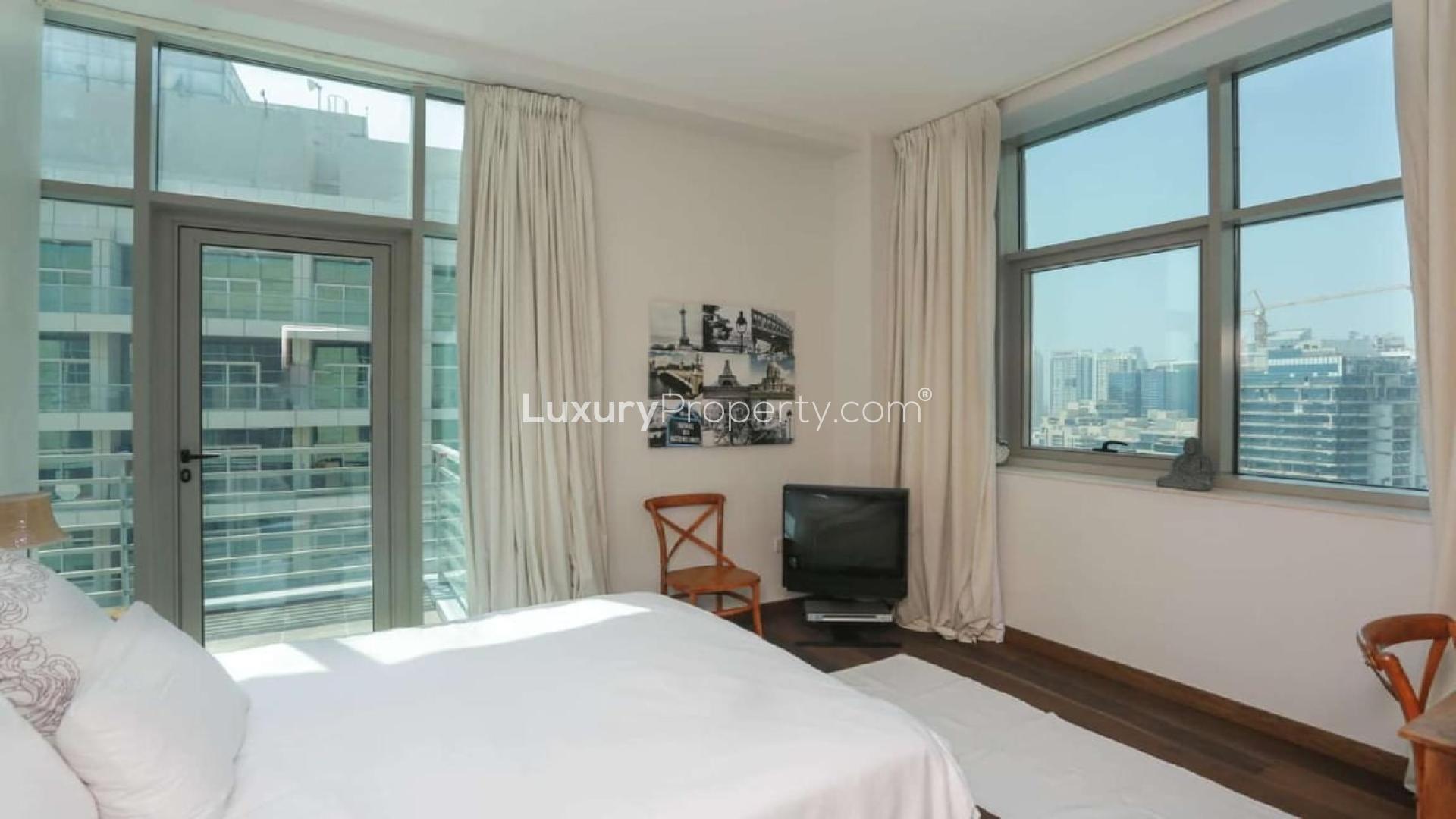 Luxurious living room in upgraded penthouse near Dubai Canal, featuring modern decor and furnishings
