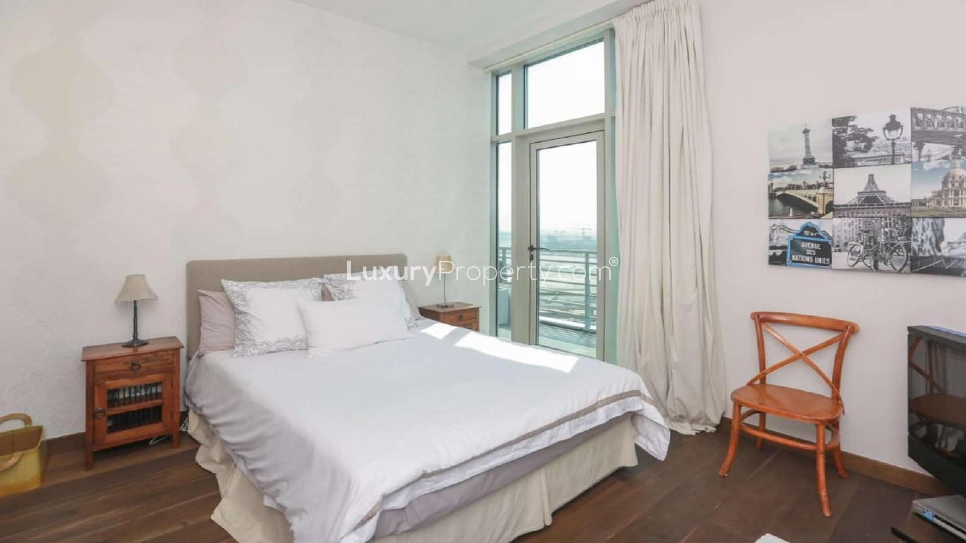 Living room view from upgraded penthouse near Dubai Canal, featuring city skyline