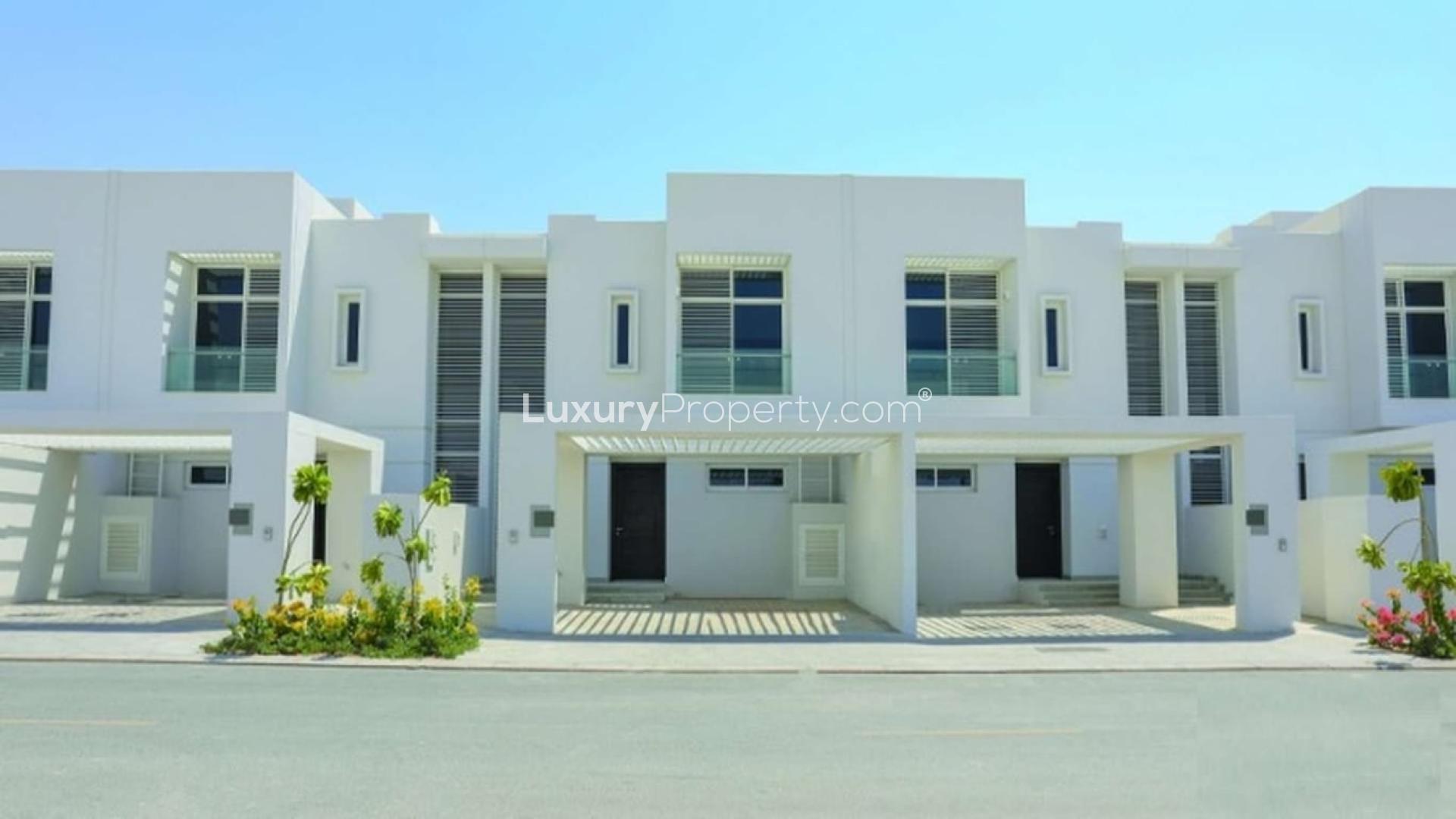 Modern 3-bedroom townhouse exterior in Arabella 1, Mudon, available for rent