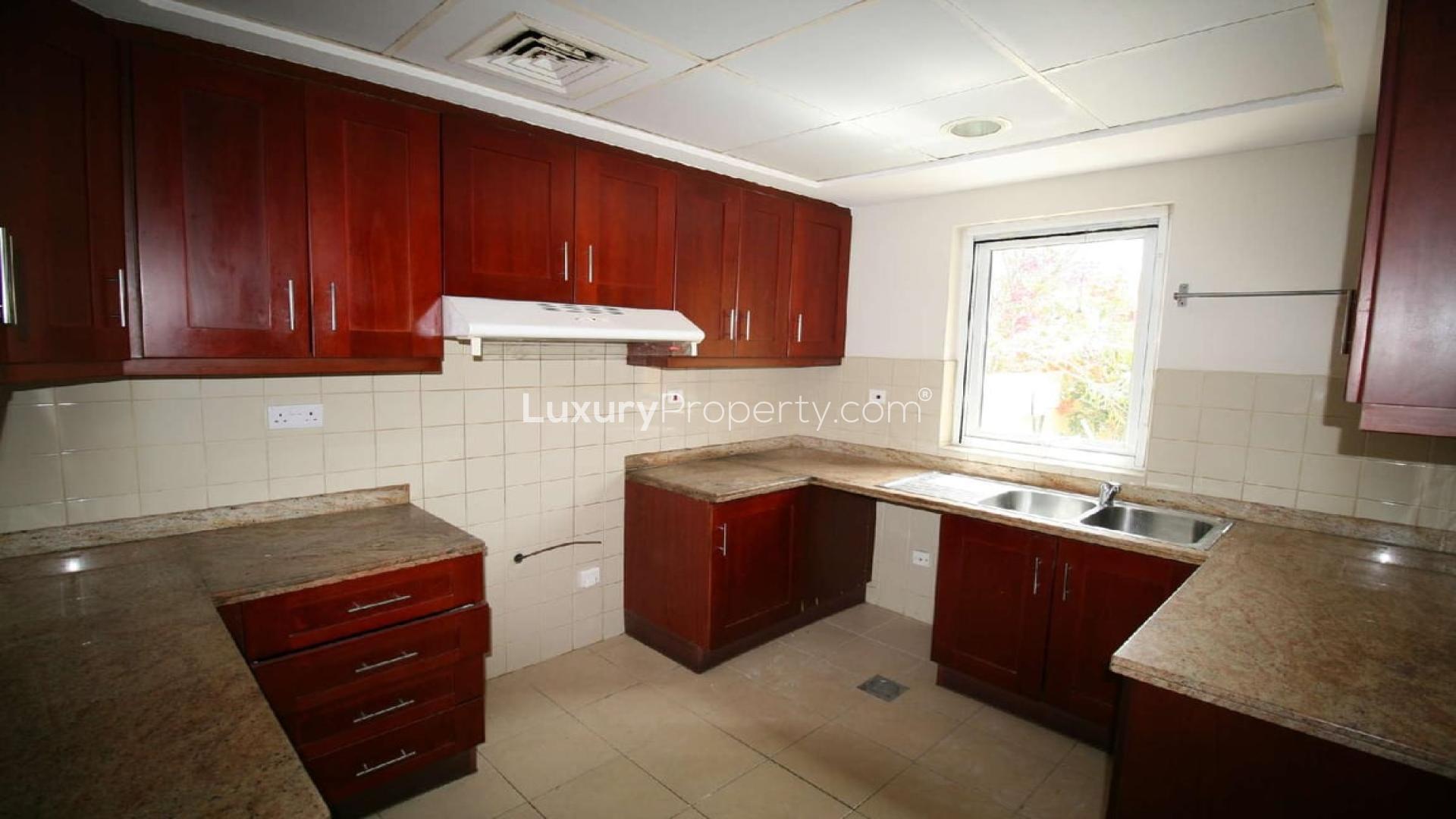 Beautiful 3-bedroom villa exterior in Palmera 3, Arabian Ranches with lush garden