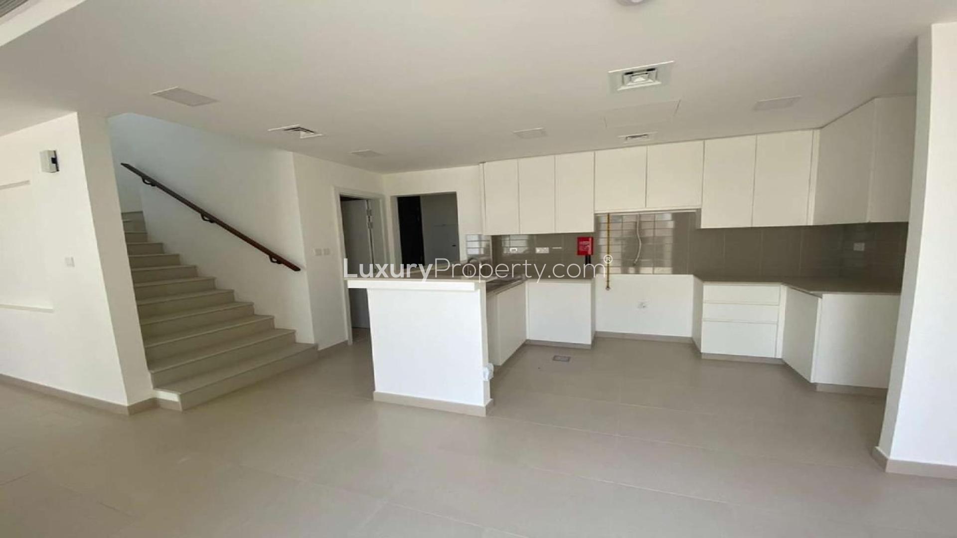 Modern kitchen and living area in 3-bedroom townhouse, Noor Town Square, available for rent