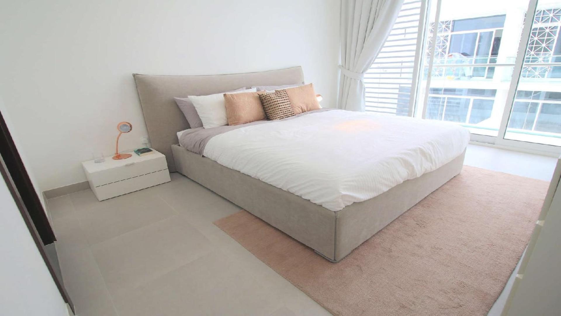 Modern living room in 3-bedroom duplex, Arabella Townhouses, Mudon, Dubai, with stylish decor