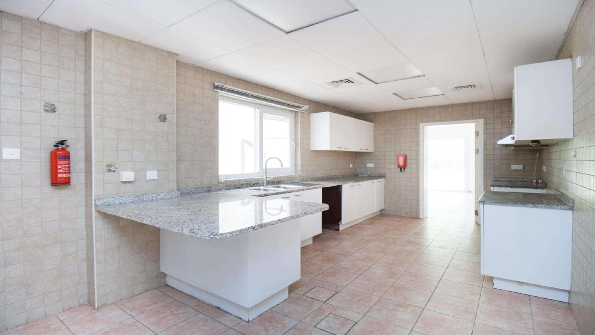 Spacious living room with garden view in Green Community East townhouse for rent