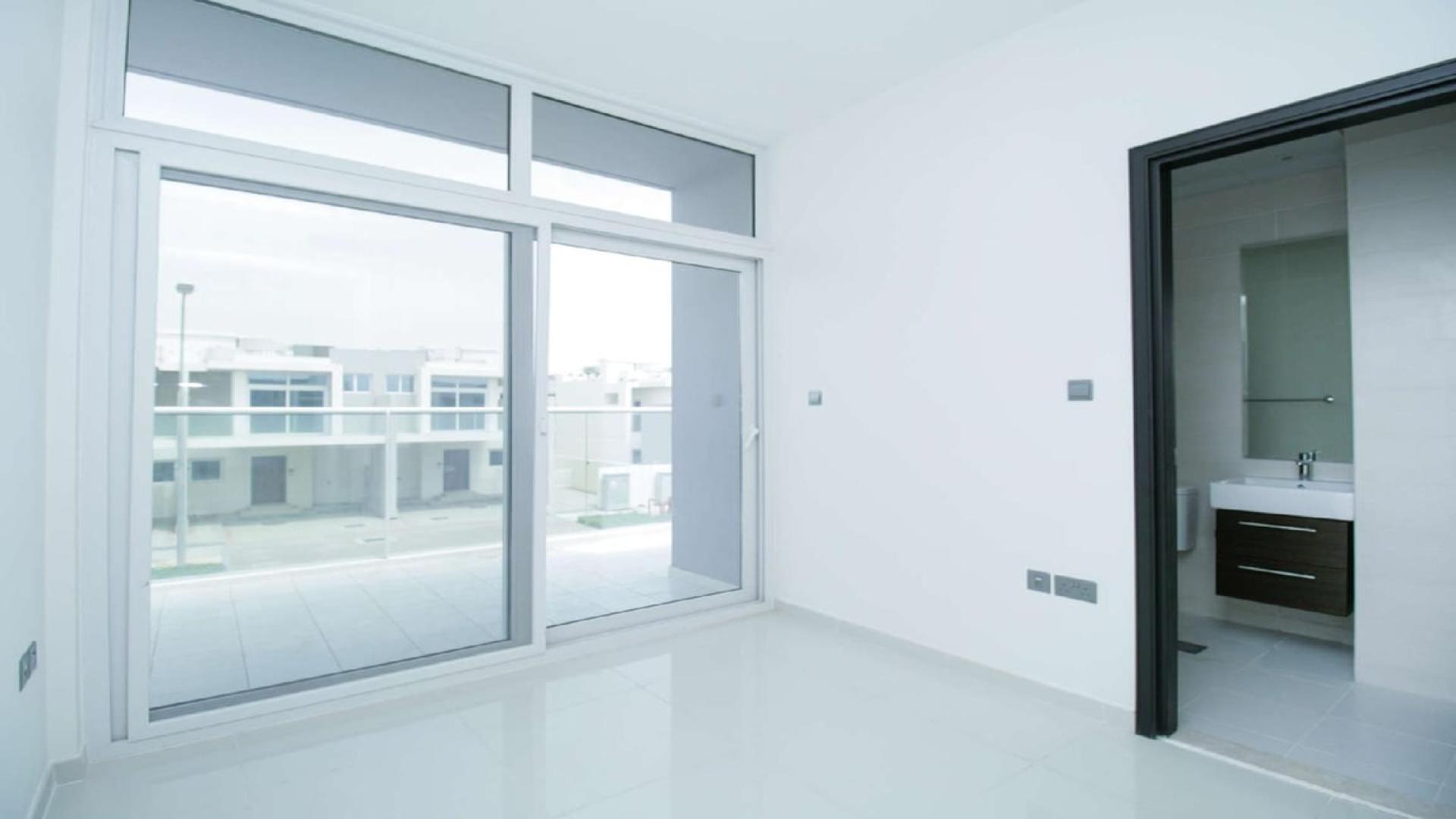 Modern white kitchen in three-bedroom townhouse for rent, Avencia, Damac Hills 2