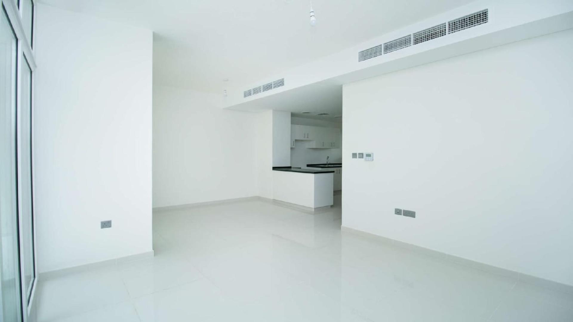 Three-bedroom townhouse exterior in Avencia, Damac Hills 2, available for rent, no cooling charges
