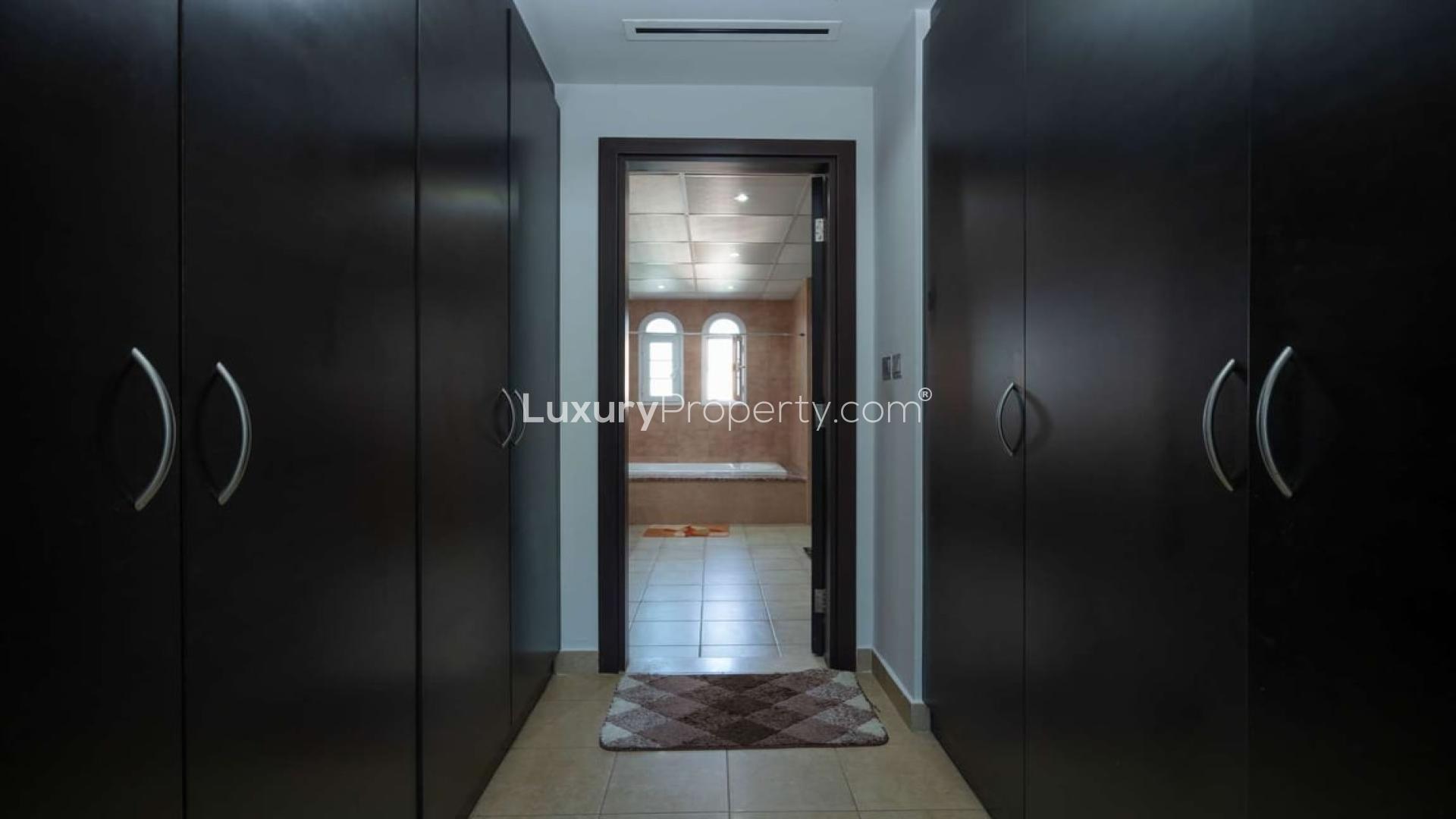 Luxurious living room in Jumeirah Village Triangle townhouse with elegant decor and chandelier