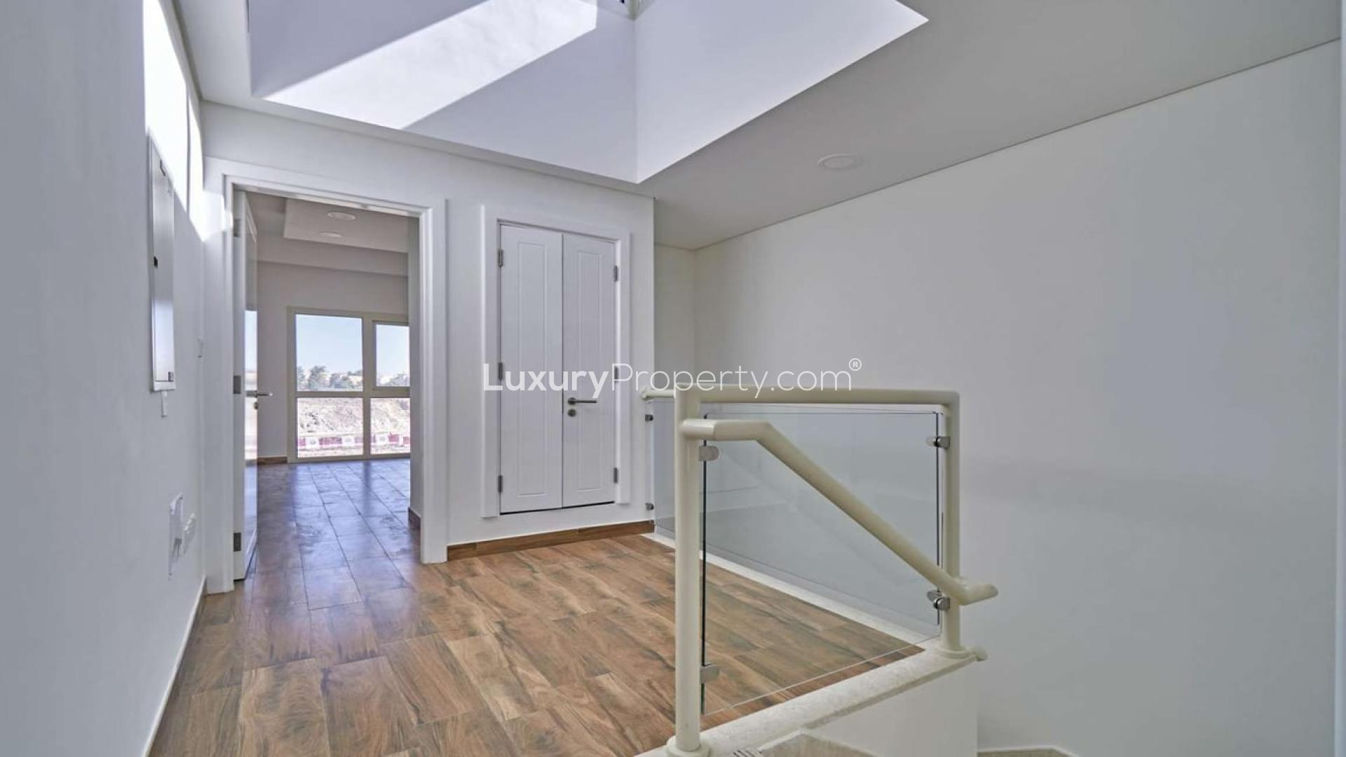 Elegant townhouse exterior with private garden in Al Andalus, Jumeirah Golf Estates for rent