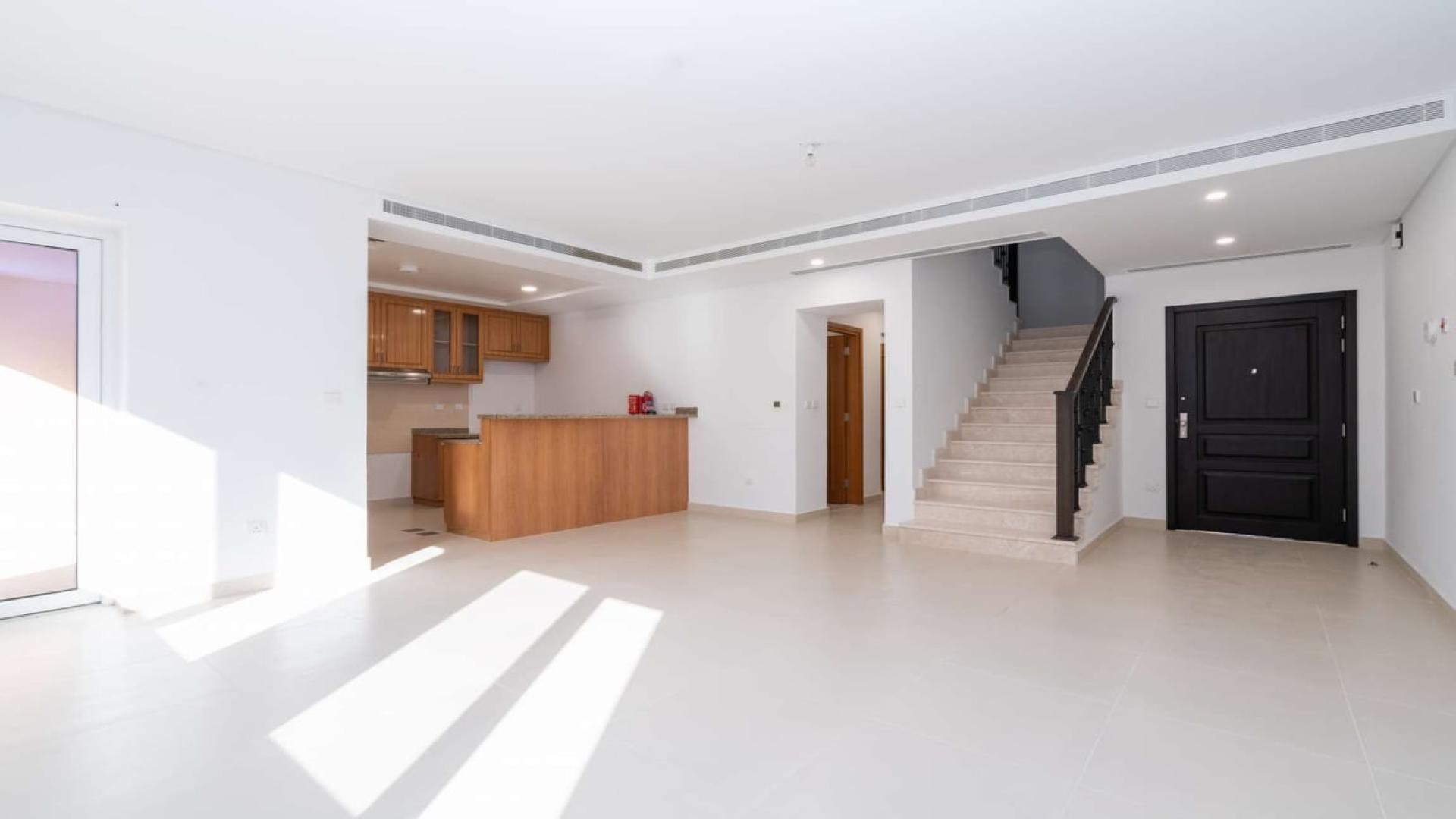 Spacious living area with stairs in Bella Casa Serena 3-bed townhouse for rent