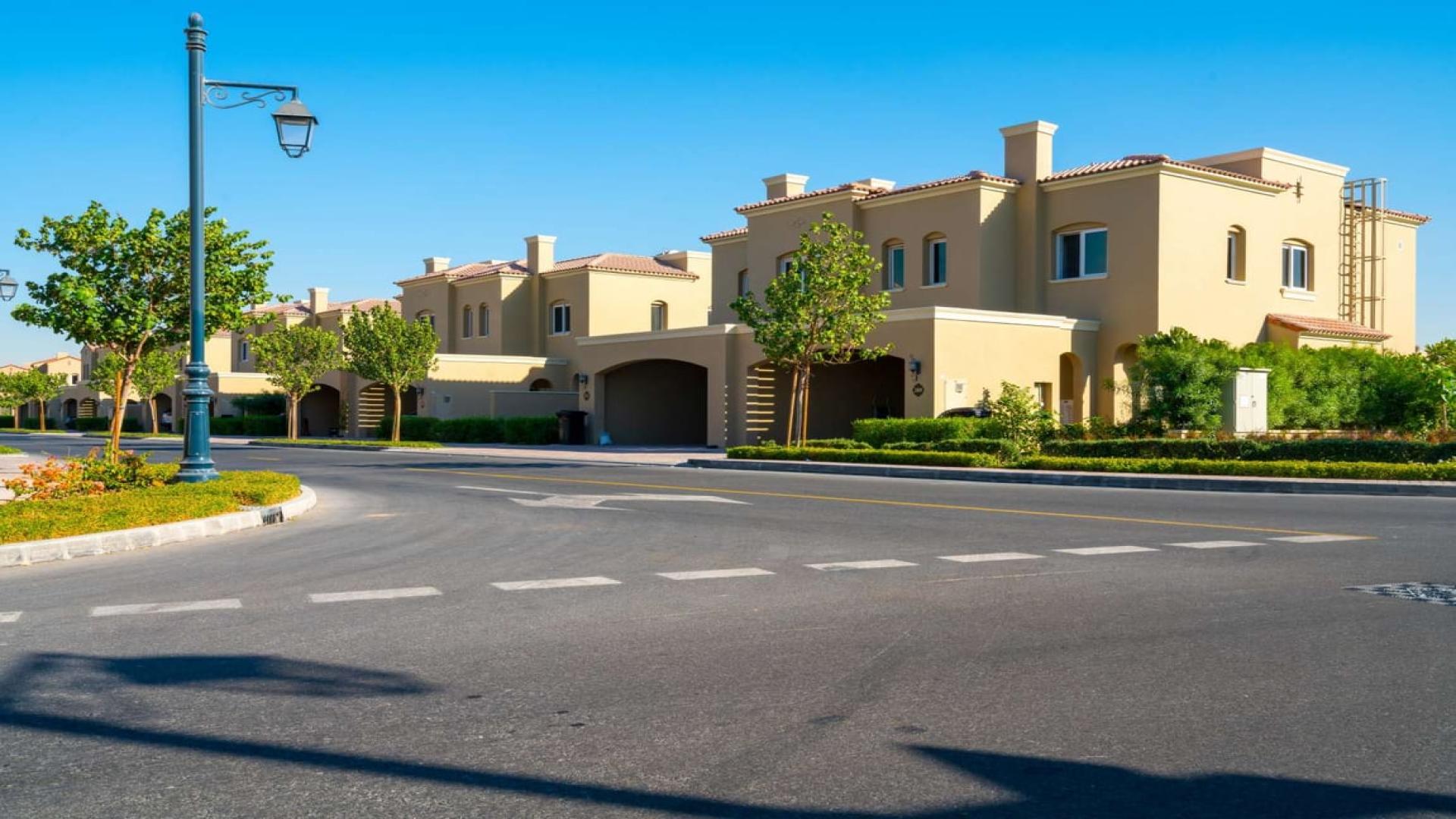 Bella Casa Serena townhouse exterior with gardens, available for rent. Peaceful community setting