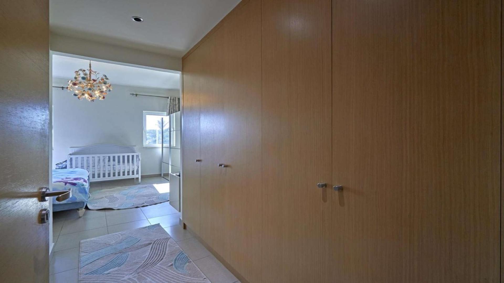 Elegant hallway in Quortaj-style townhouse, Al Furjan, featuring modern staircase and decor