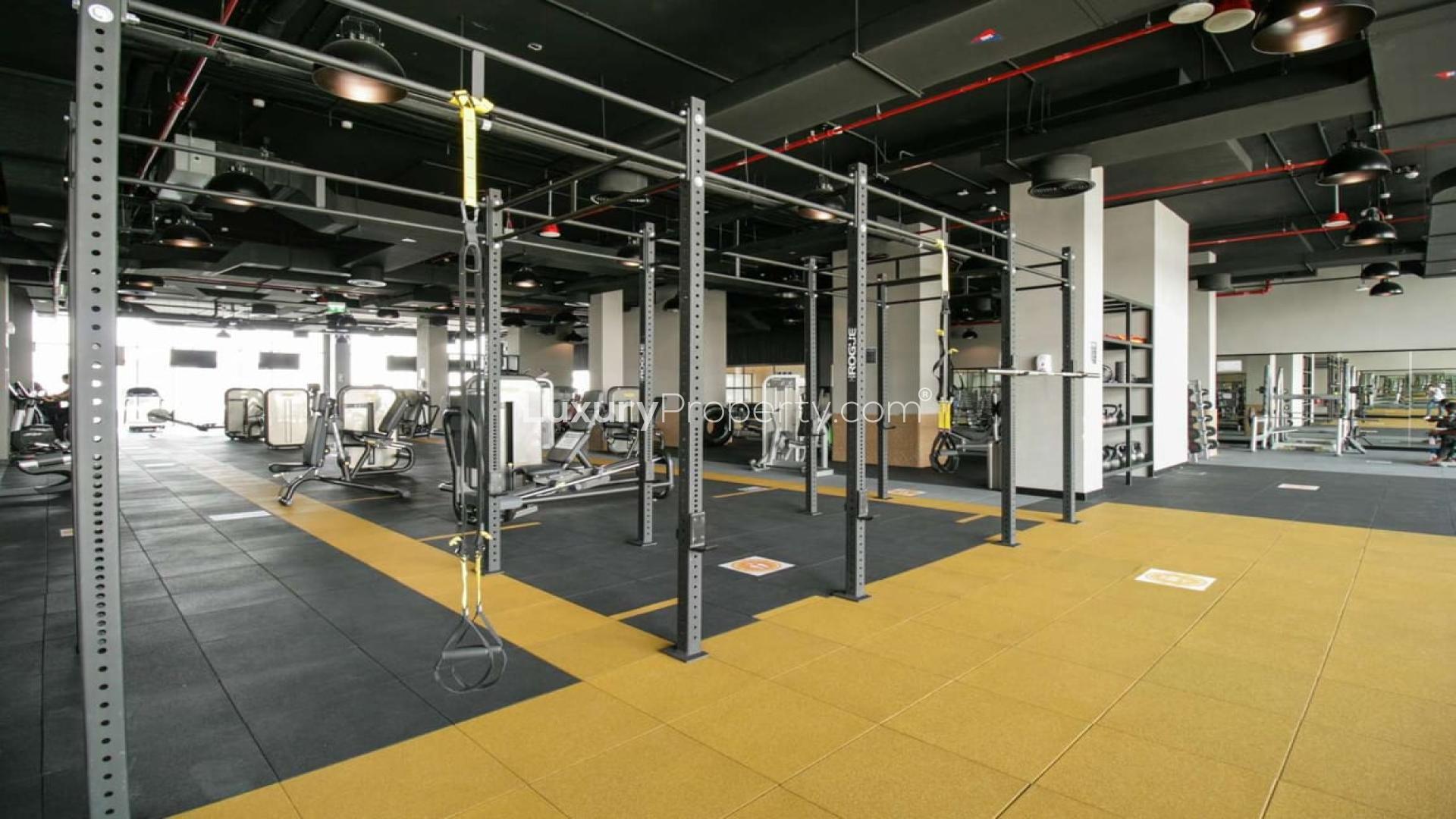 Modern kitchen and living area in Damac Hills 2 townhouse for rent, Avencia community