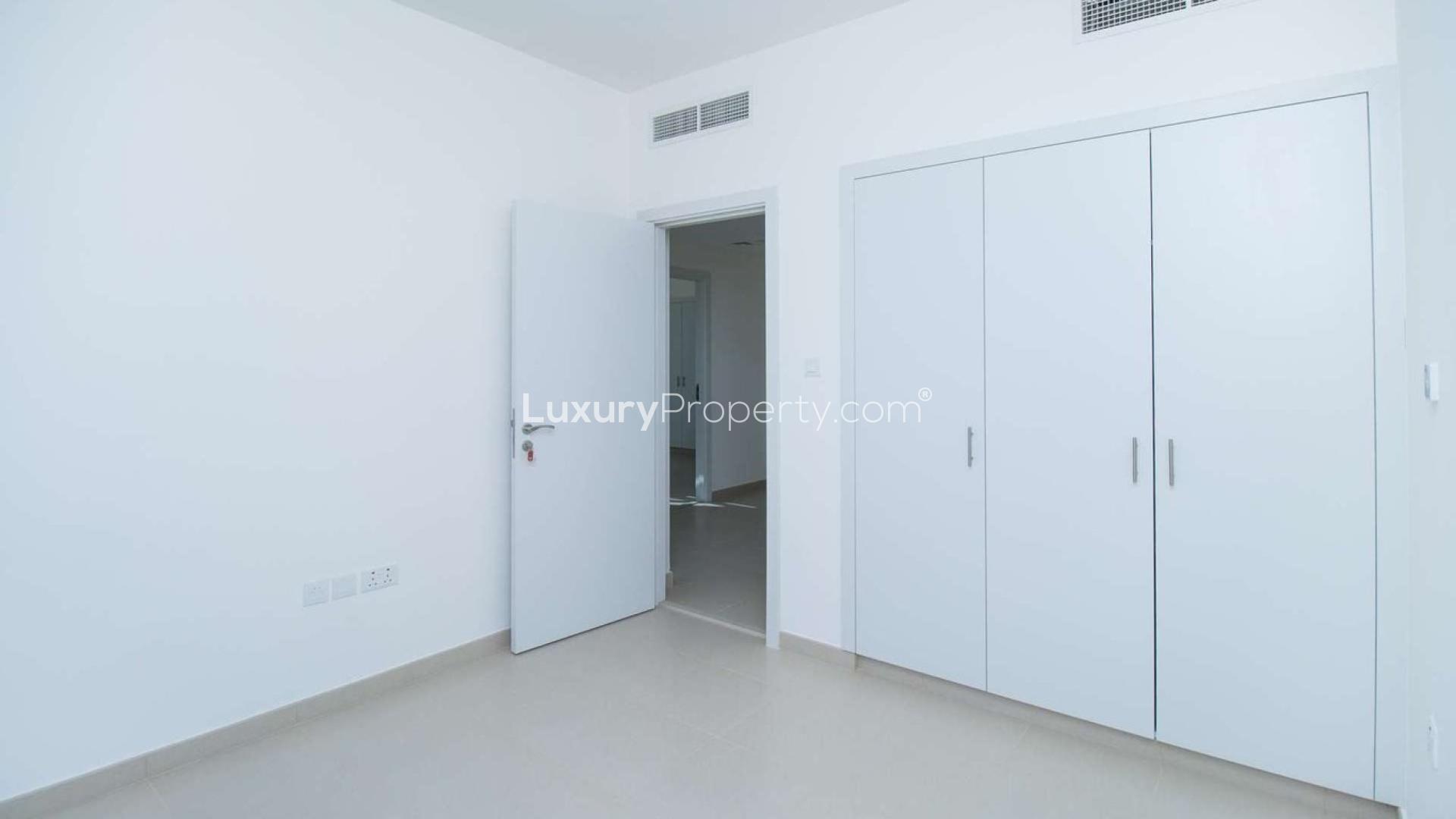 Modern 3-bedroom townhouse exterior in Noor Townhouses, Town Square, available for rent