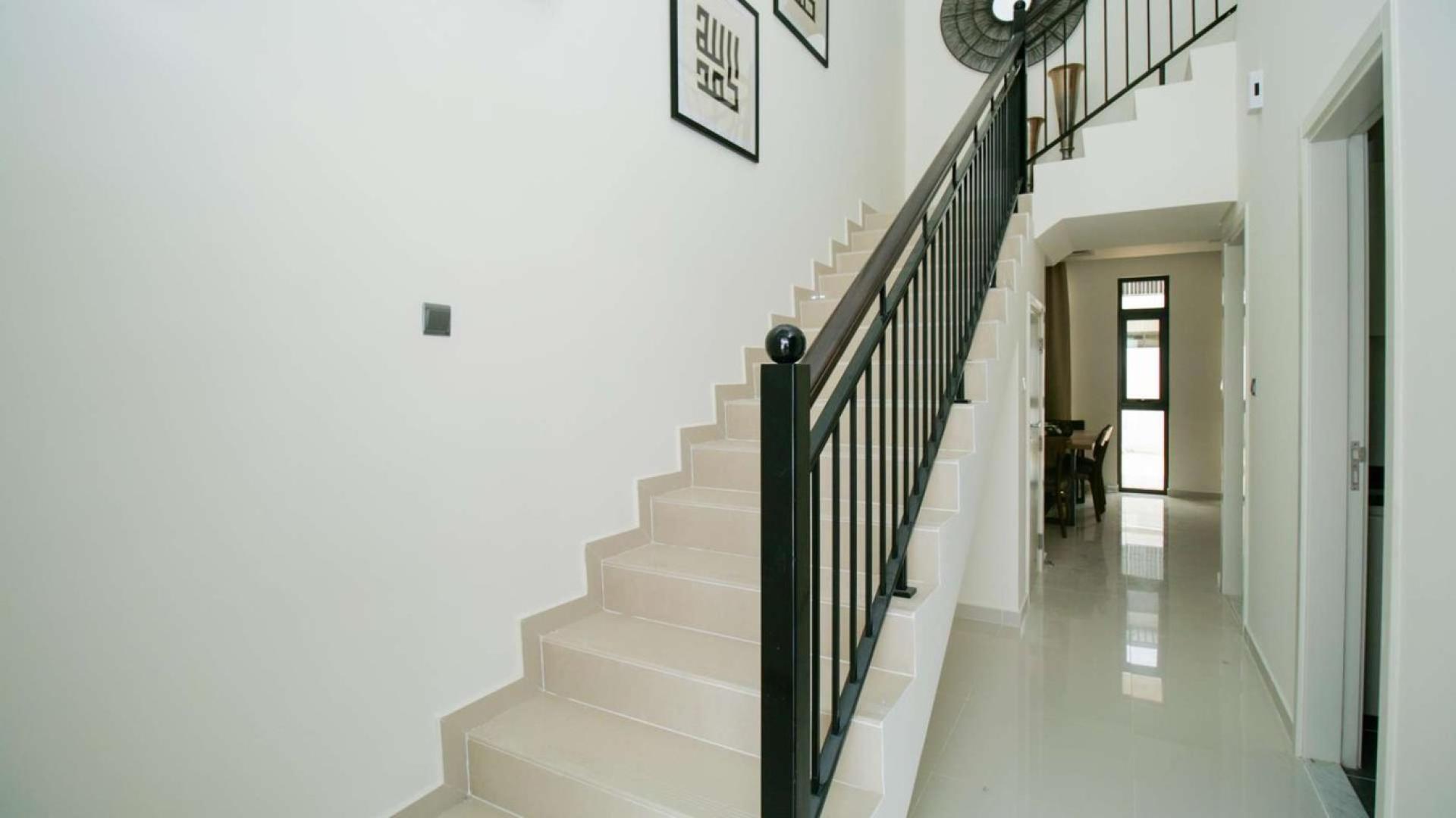 Living room of 3-bedroom townhouse in Zinnia, Damac Hills 2, with modern furnishings