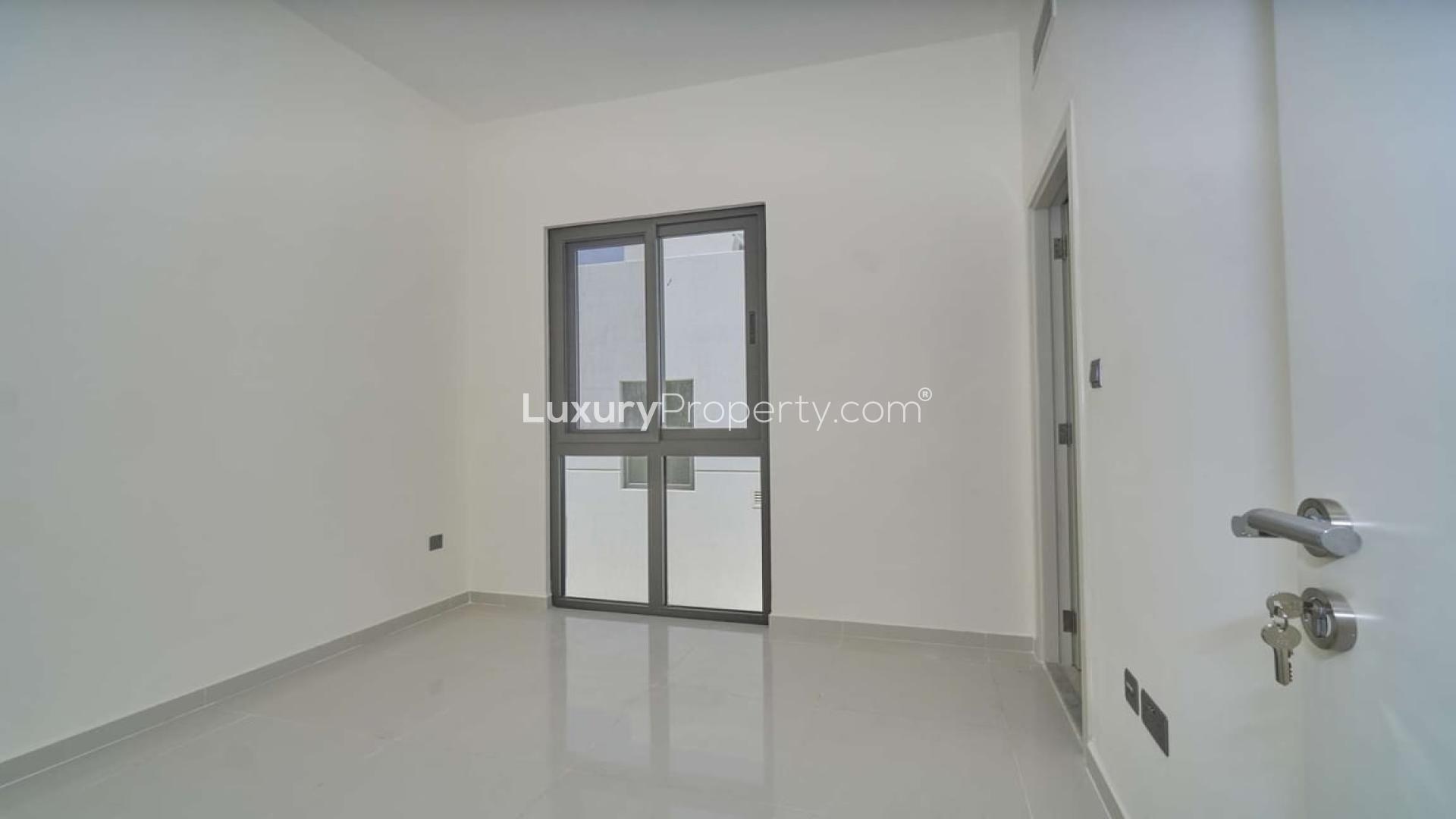 Front view of modern 3-bedroom townhouse for rent in Damac Hills 2, Sanctnary