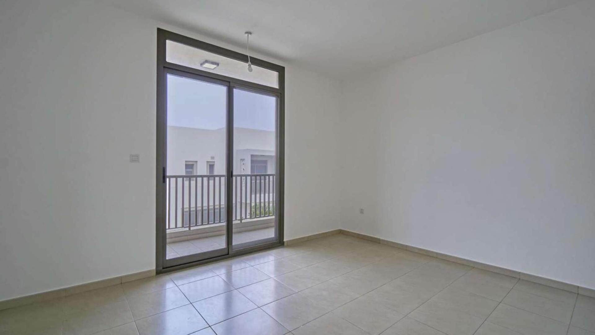 Modern kitchen and staircase in three-bedroom townhouse, Hayat Townhouses, Town Square, Dubai