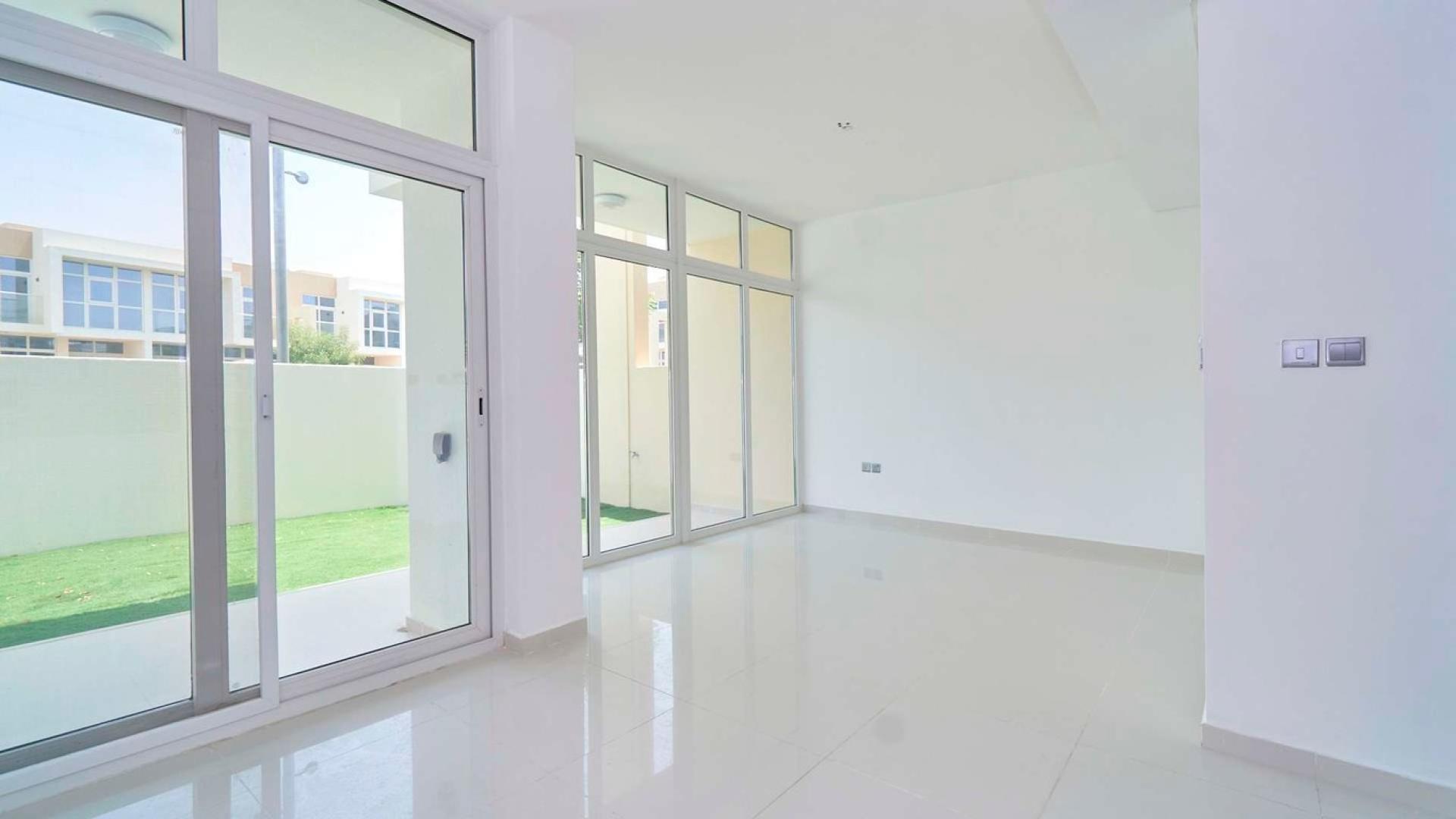 Immaculate living area with large windows in 3-bedroom townhouse, Damac Hills 2, Avencia