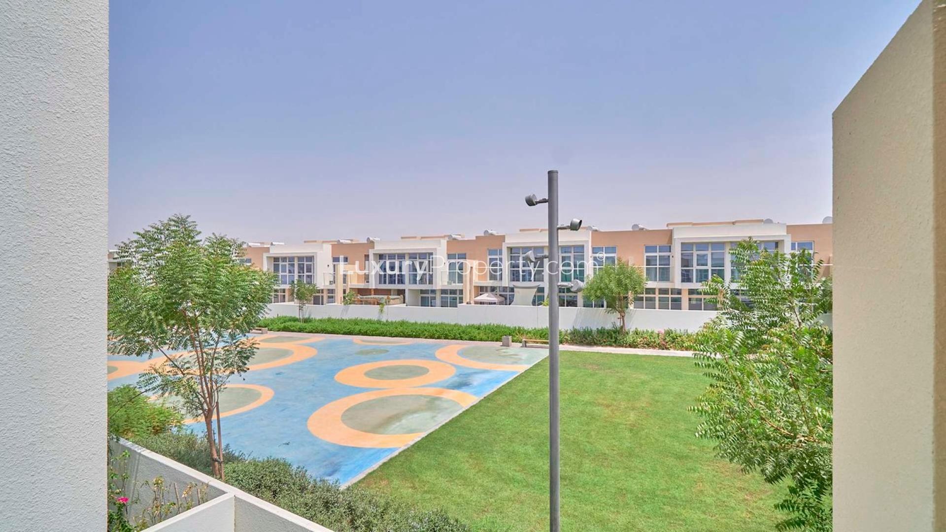 Fully upgraded townhouse exterior in Amazonia, Damac Hills 2, for rent