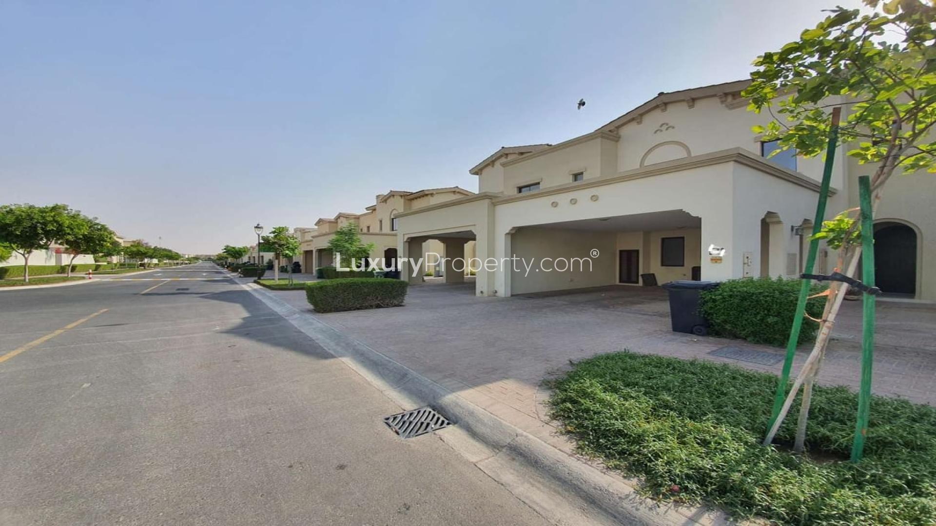 Spacious 3-bedroom townhouse exterior with landscaped garden in Mira, Reem community