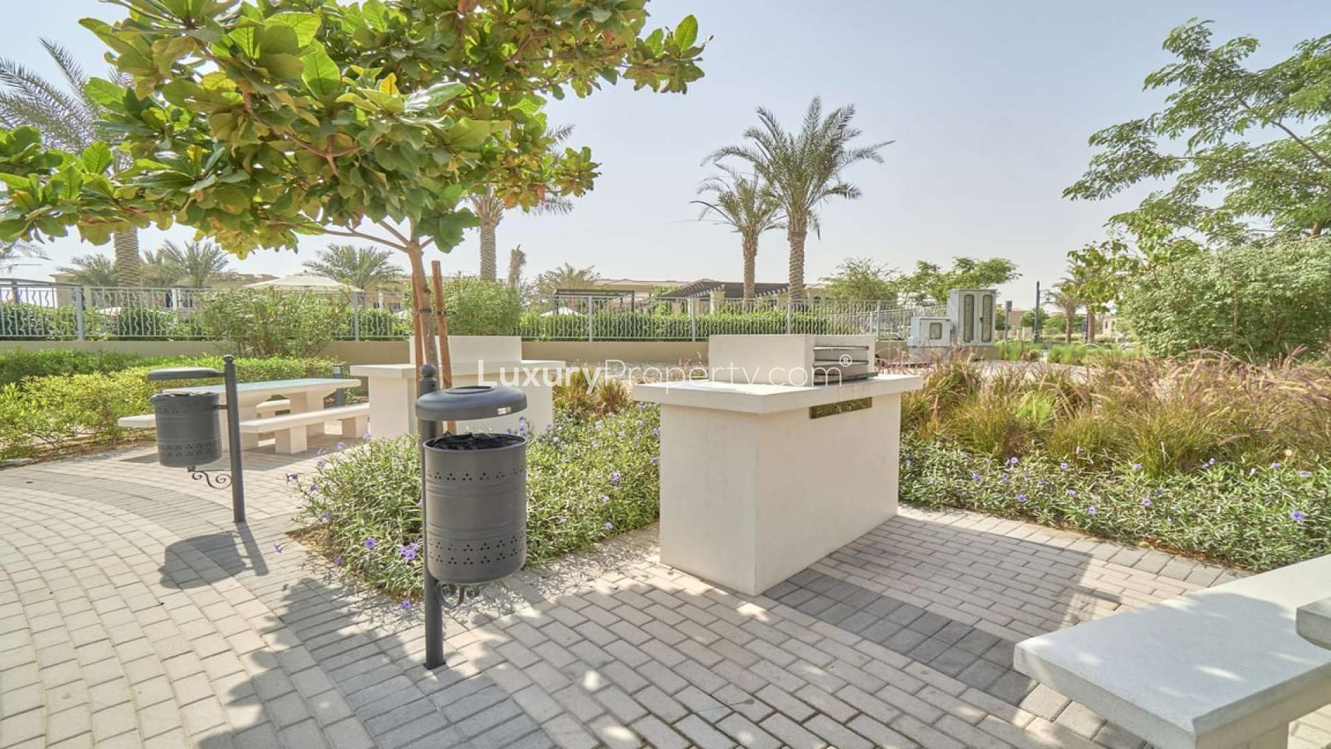 Playground in Casa Viva, Serena, Dubai townhouse community with shaded play area and slide