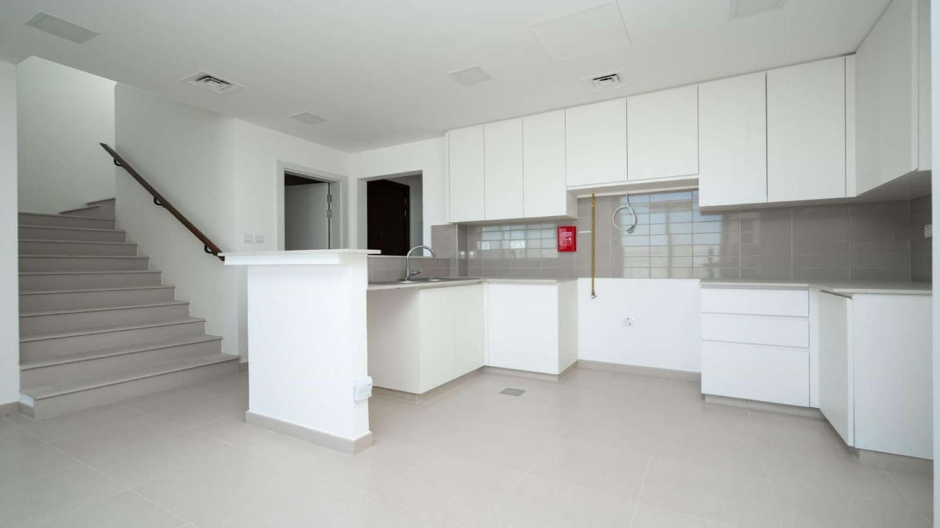 Modern kitchen area in spacious Hayat Townhouse, Town Square, available for rent